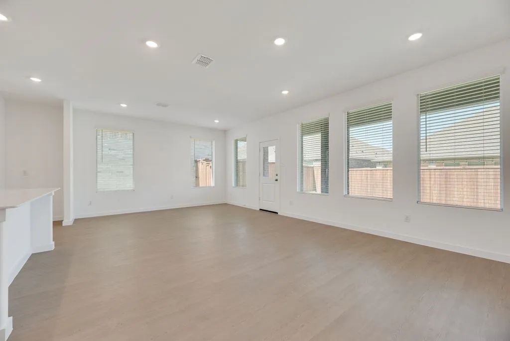 Spare room with recessed lighting and light wood-style flooring