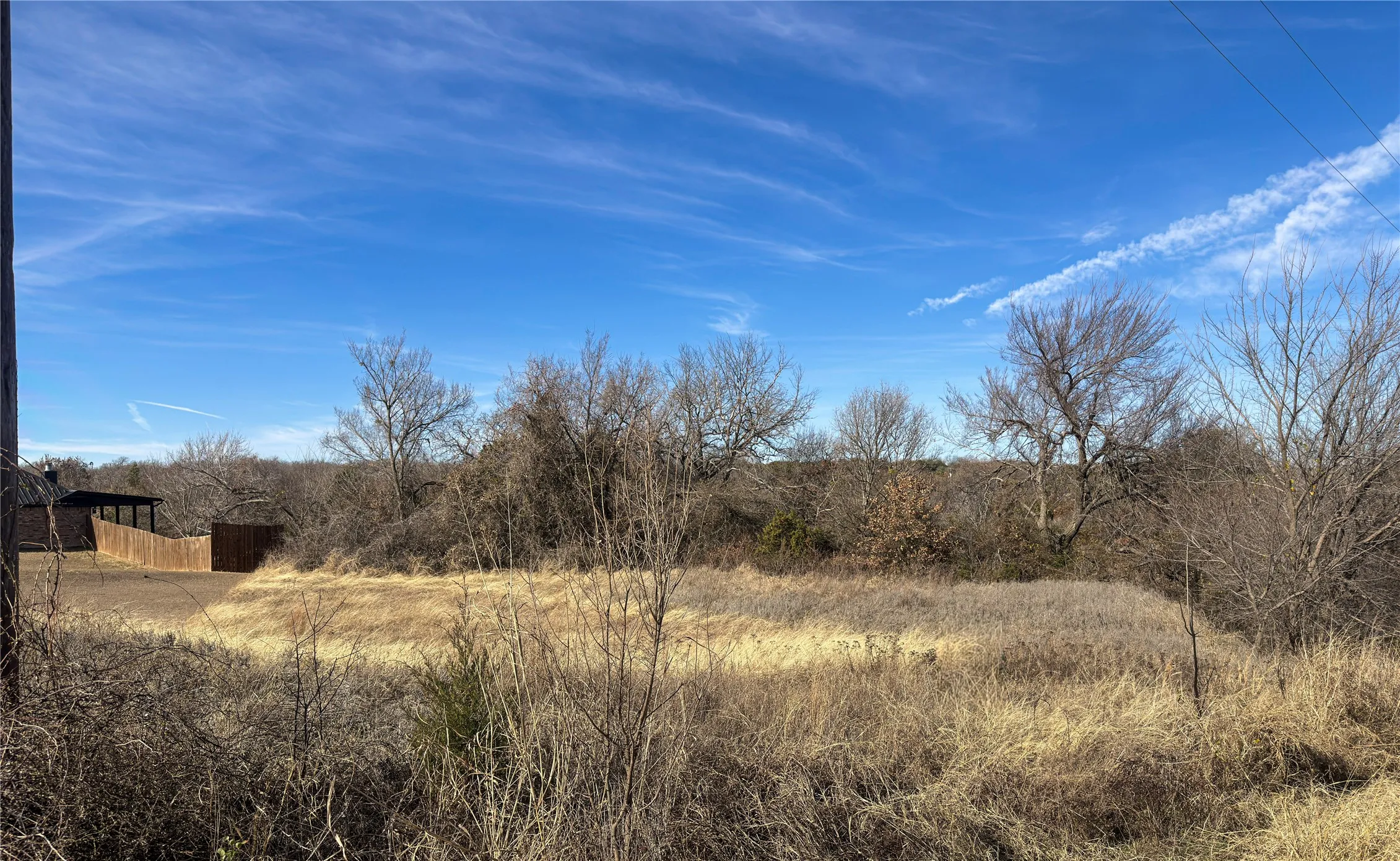A larger view of the property.  The area that has been mowed belongs to the home you see on the left and the tree line is the boundary before the property dips towards the pond/creek.