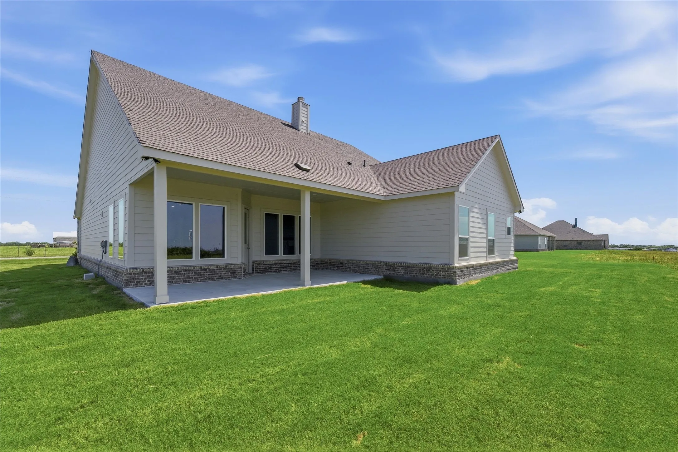 Spacious covered patio with concrete flooring