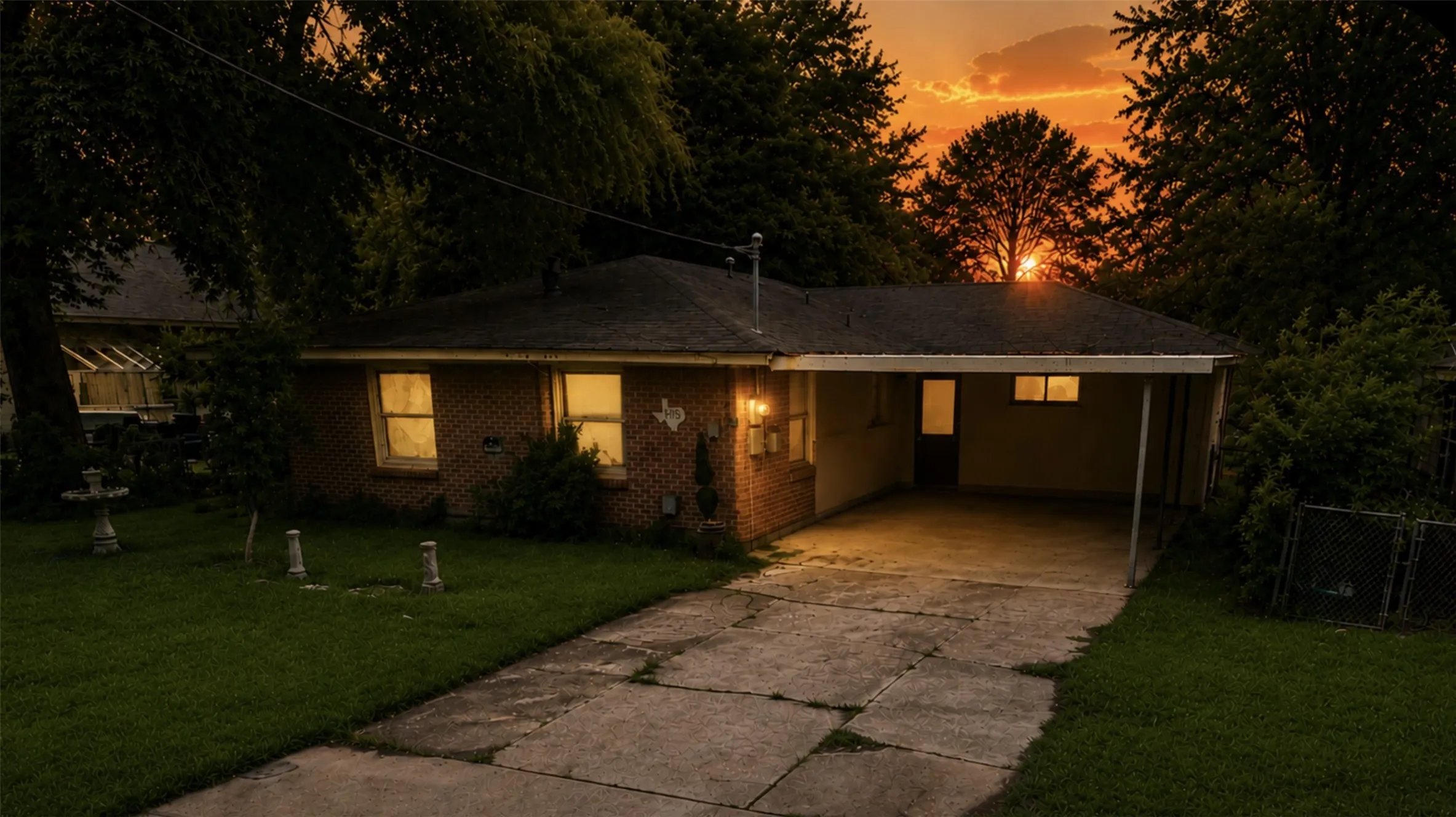Virtual Sunset Photo 837 Cranford. 1 of 2 houses included in this listing. Brick exterior with a carport and concrete driveway