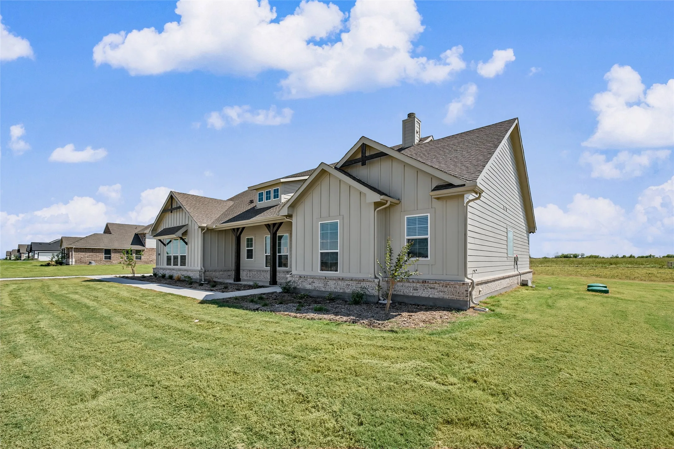 Craftsman-style exterior with board and batten siding, horizontal siding, and stone accents