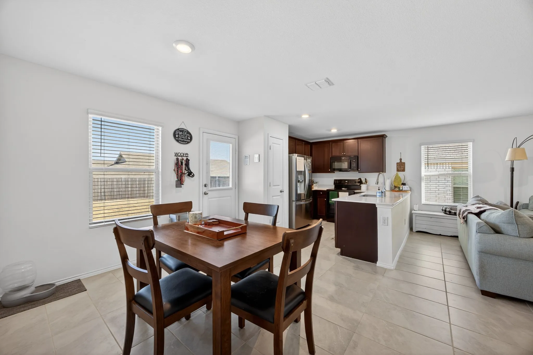 Dining room featuring recessed lighting and light tile patterned flooring