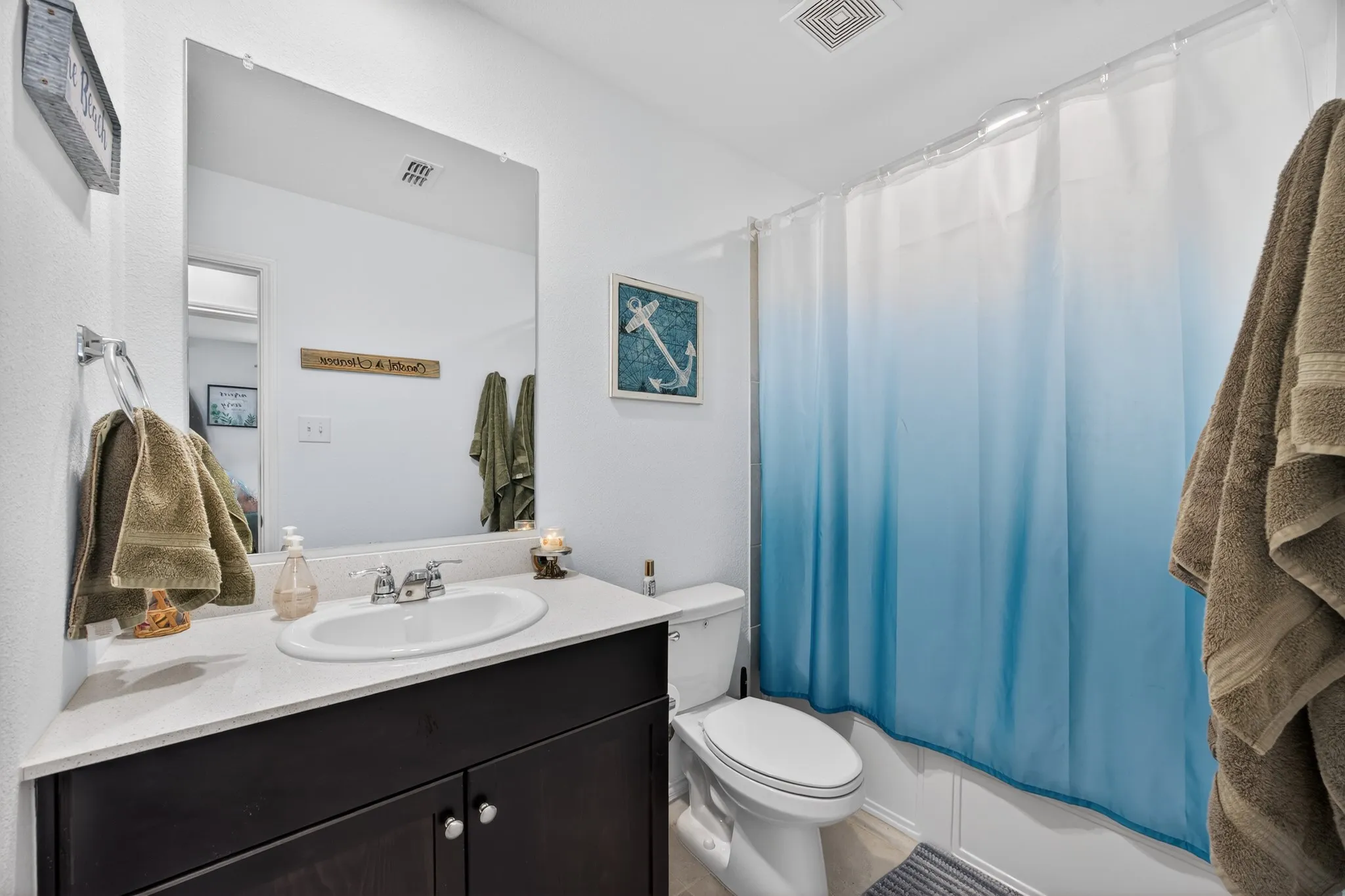 Full bathroom featuring vanity and shower / bath combo with shower curtain