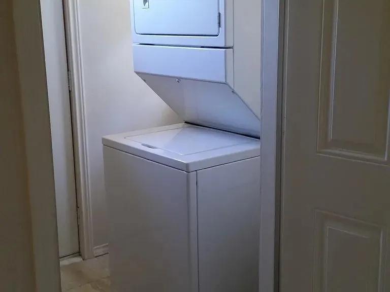 Laundry room with stacked washer / dryer