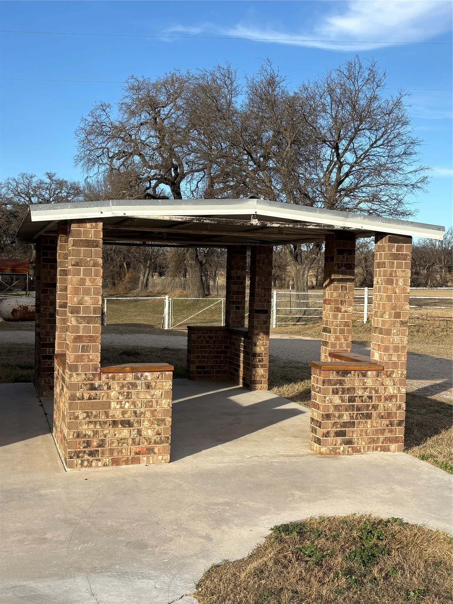 View of property exterior featuring a patio.  Perfect setup for the grill and firepit.