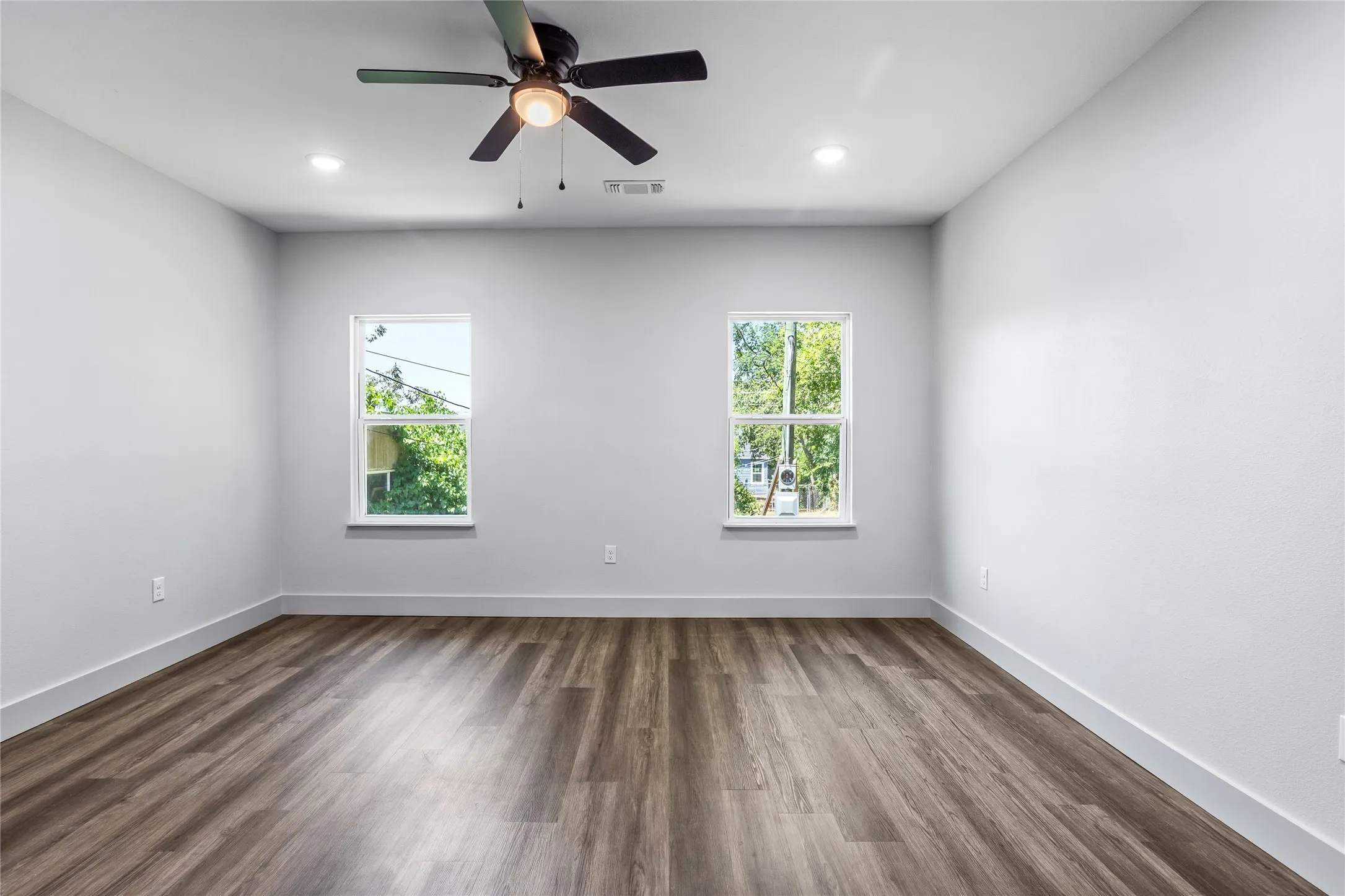 The primary bedroom is at the back of the house.  Great space with a nice view out the back windows.