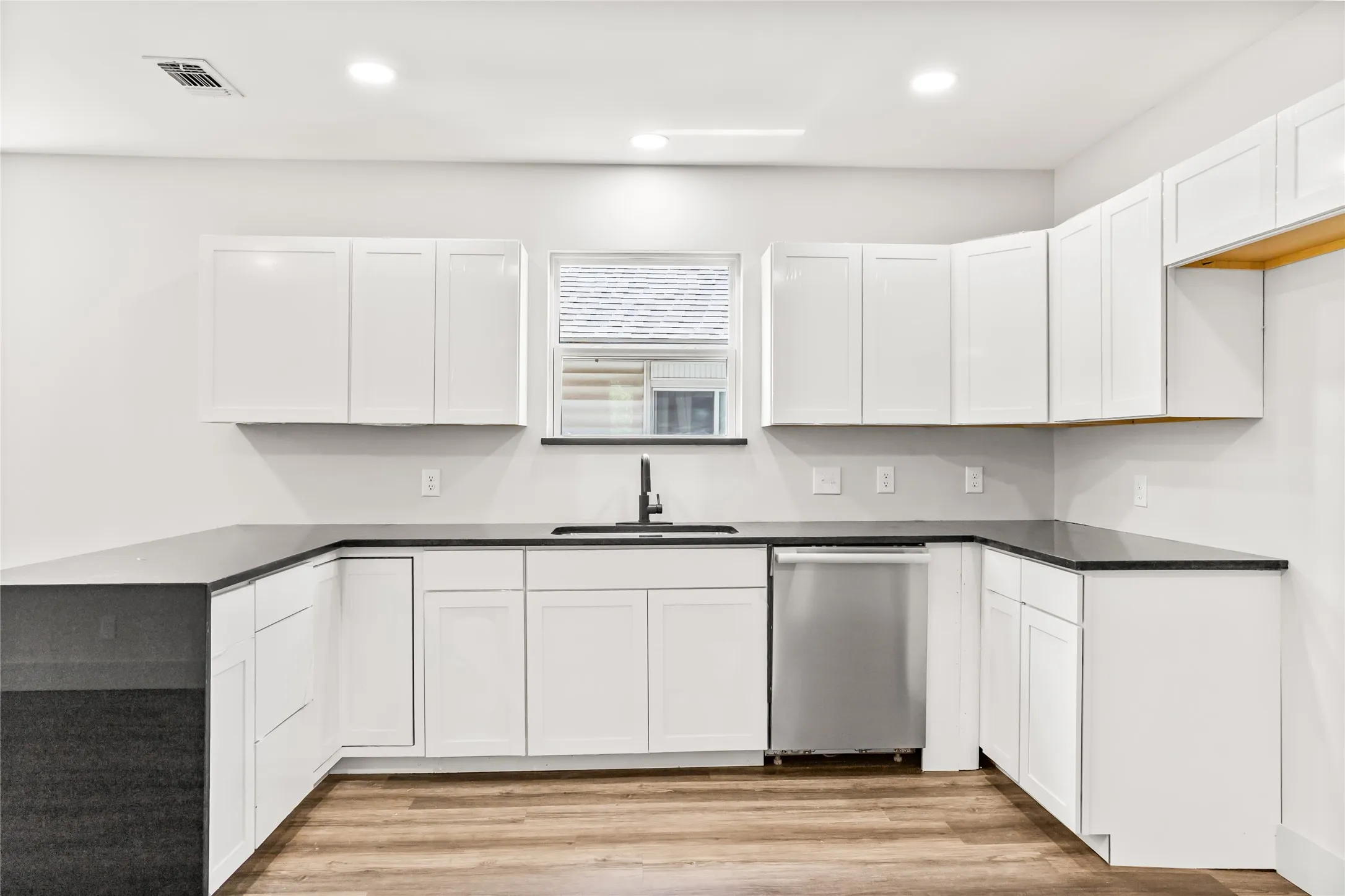 Thoughtfully designed kitchen offering ample prep space and storage.