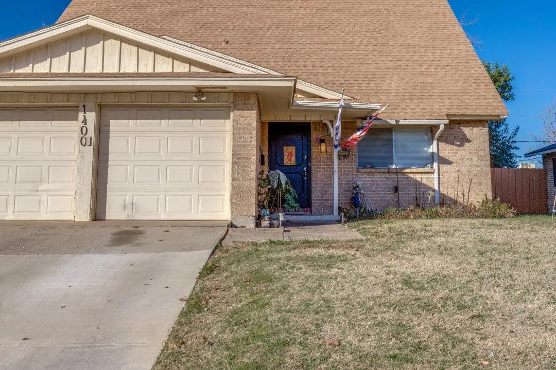 Front approach with wide driveway parking