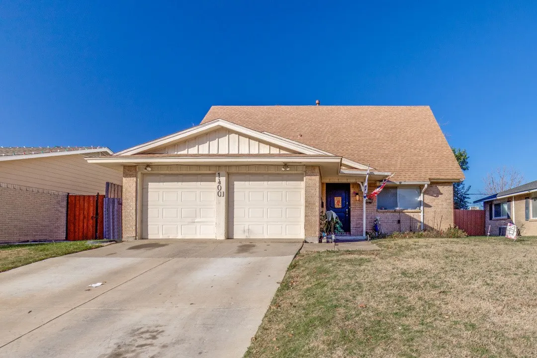 Classic brick front with attached two-car garage