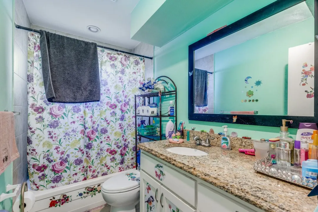 Full bath with stone-look vanity