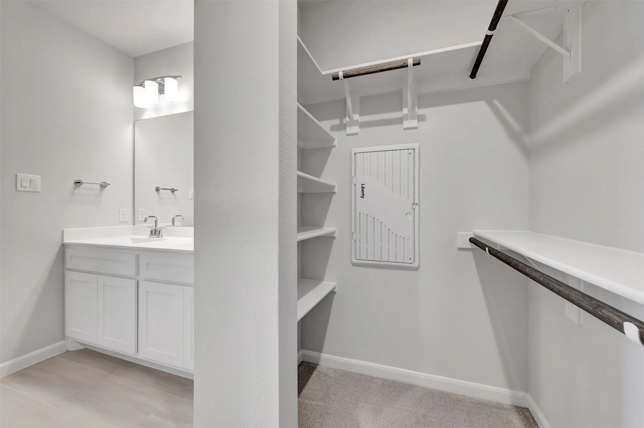 Walk-in closet with integrated shelving and hanging rods
