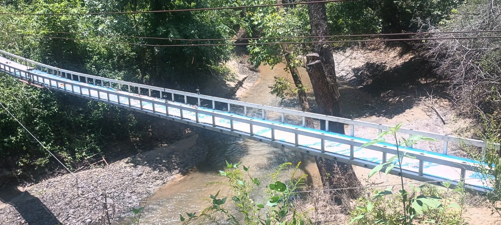 bridge over the creek leading to rest of property