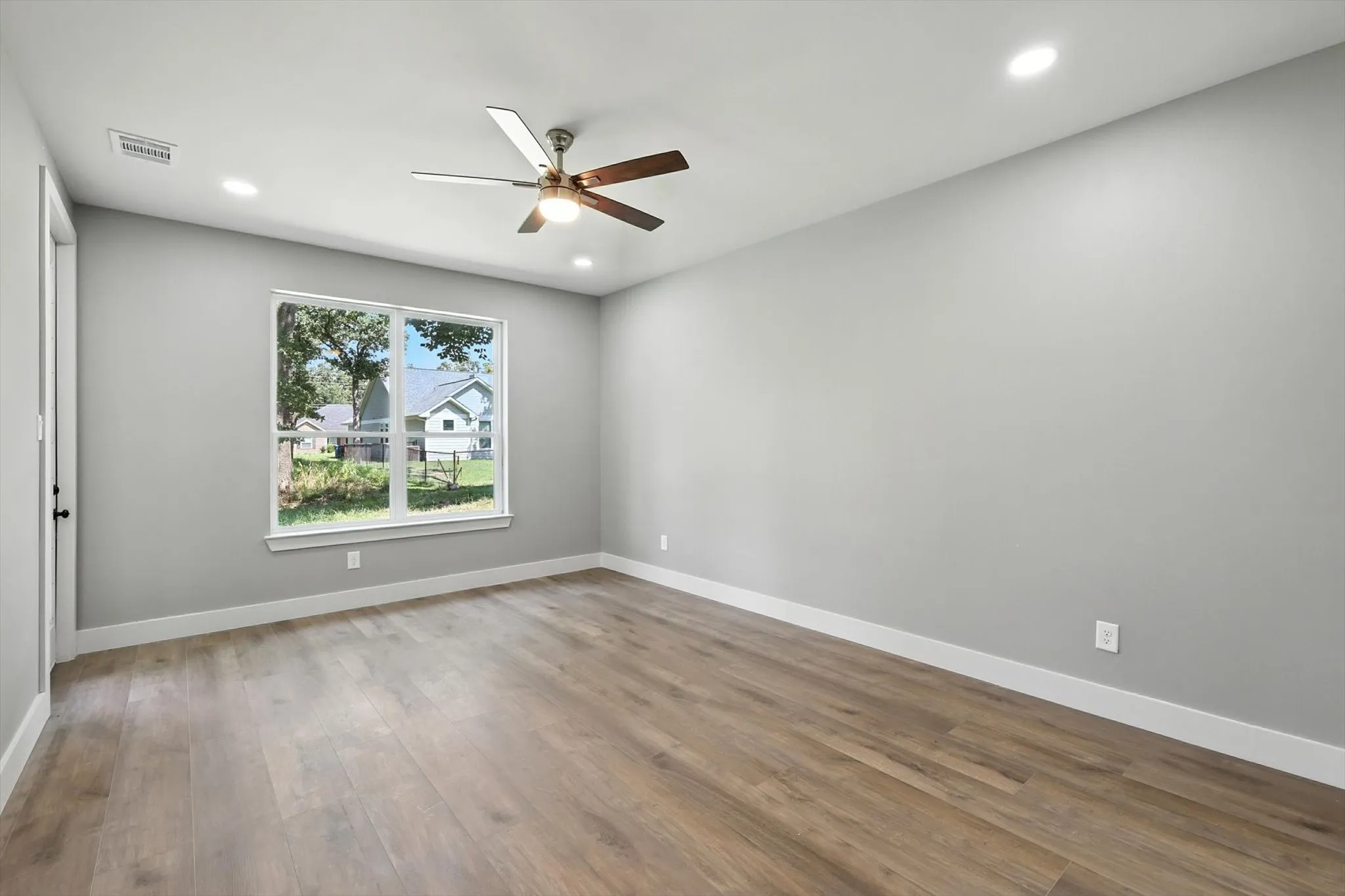 Spare room featuring light wood-style flooring, recessed lighting, and ceiling fan