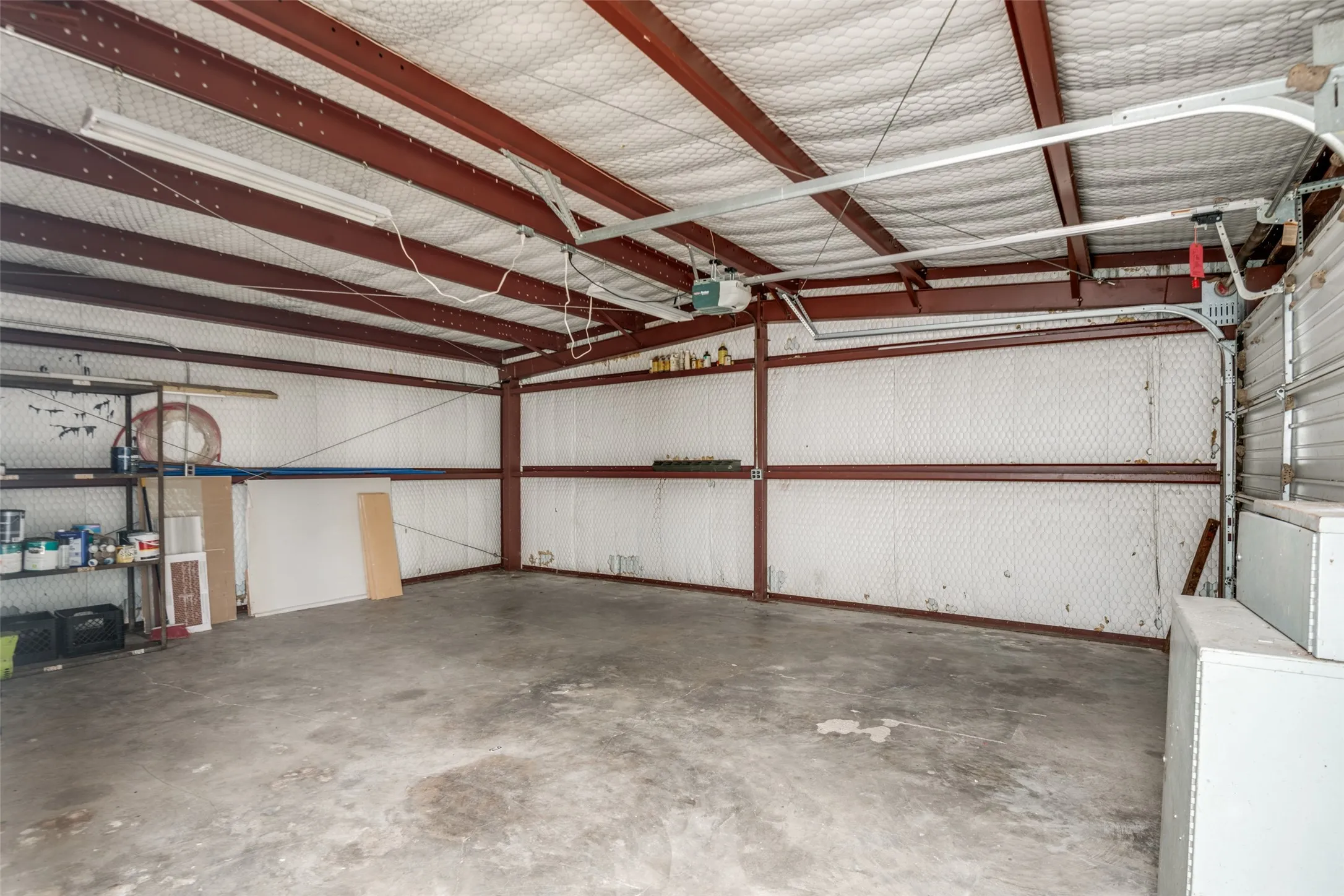 Garage featuring washer / clothes dryer and a garage door opener