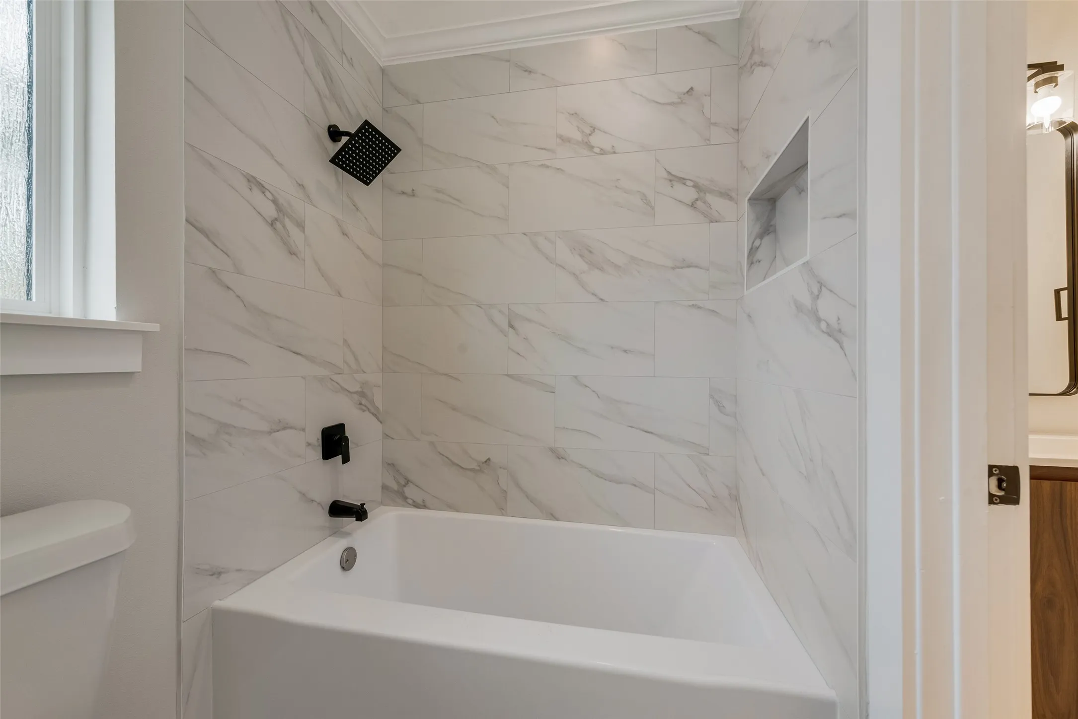 Bathroom featuring shower / bath combination, vanity, and ornamental molding