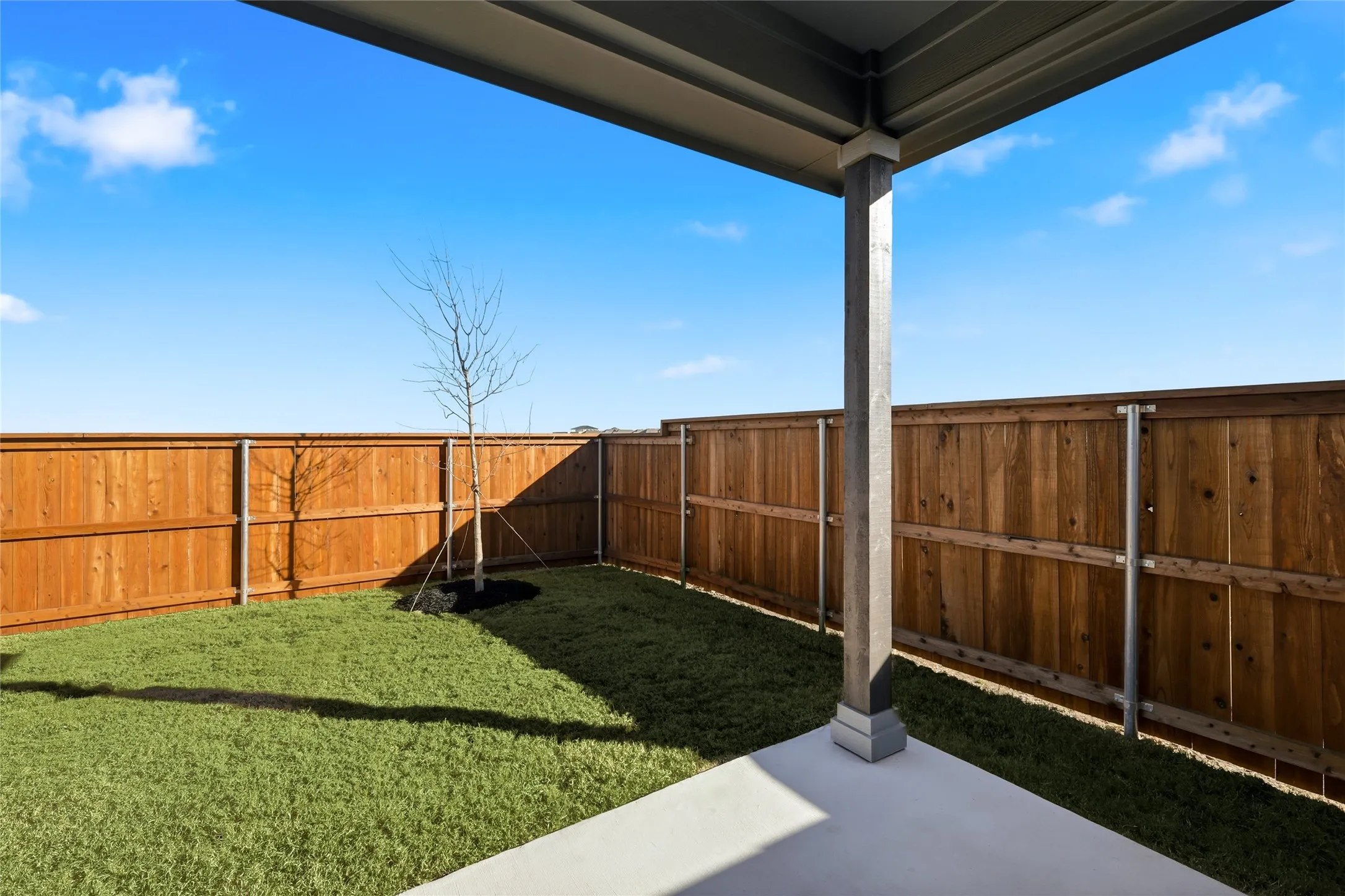 Covered patio with a concrete surface