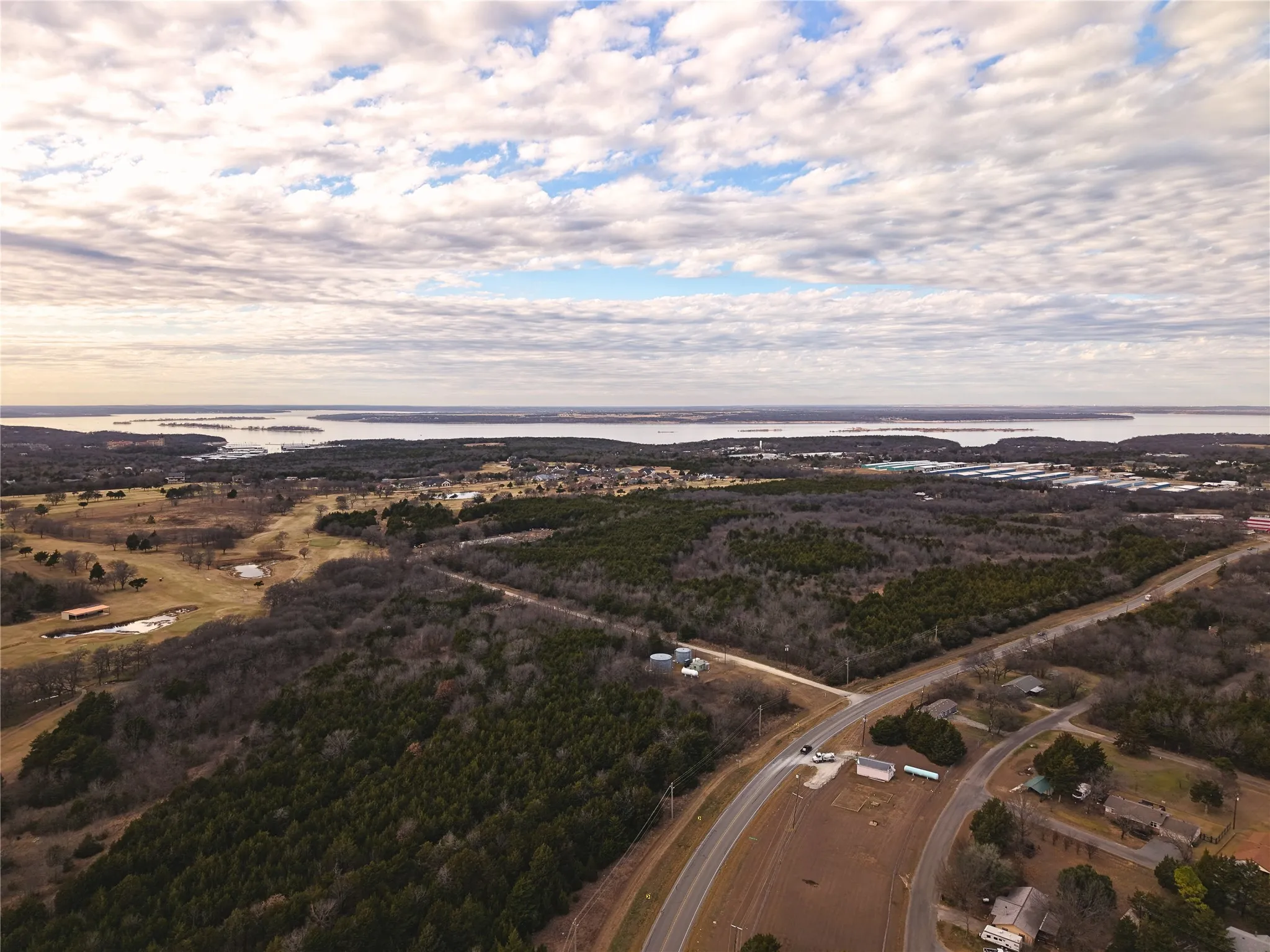 Aerial overview of property's location with a large body of water