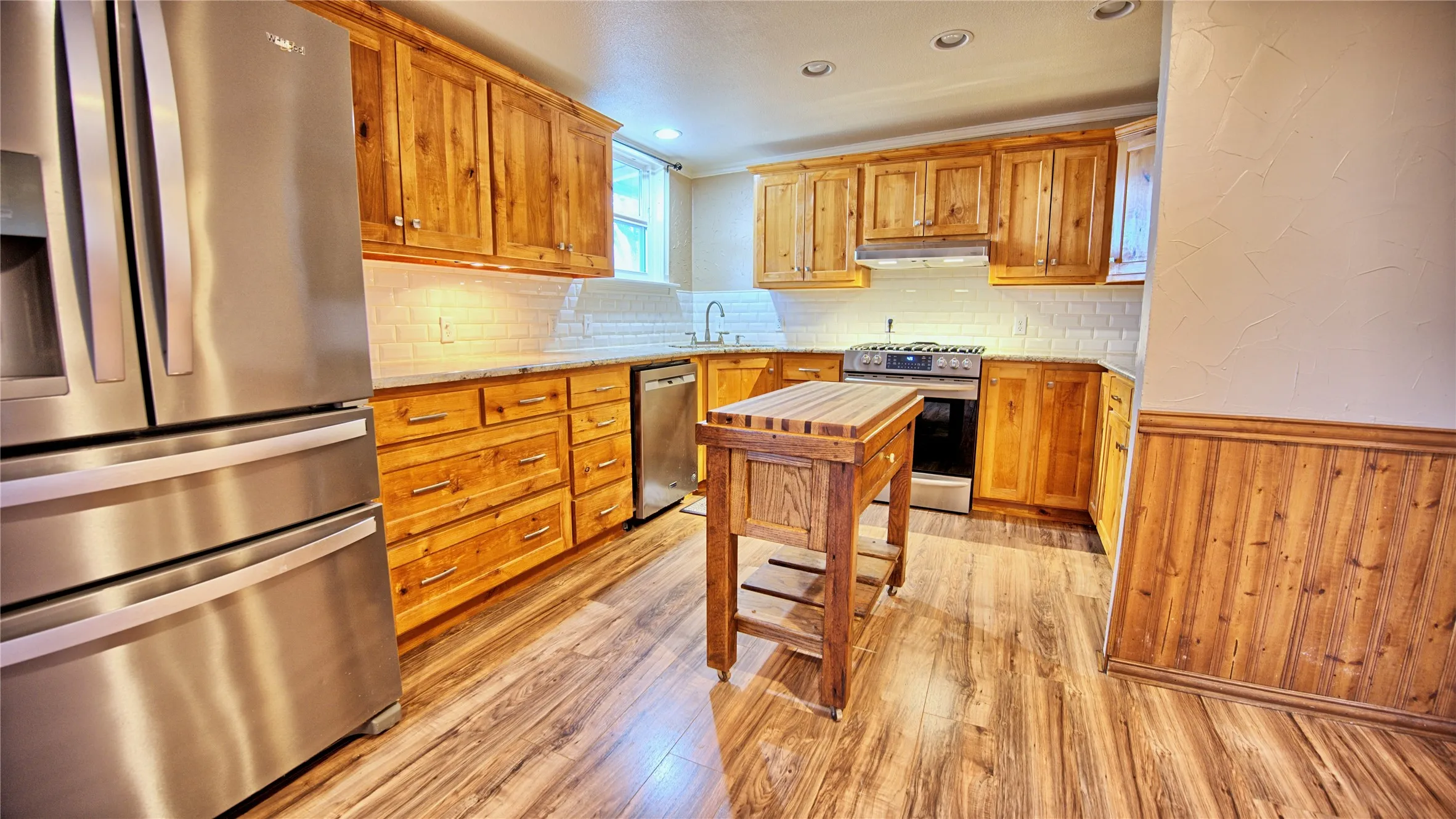 Remodeled kitchen, refrigerator conveys