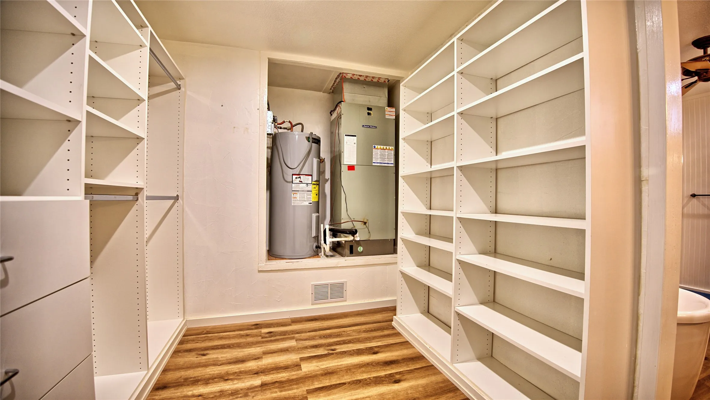 Custom primary bedroom closet