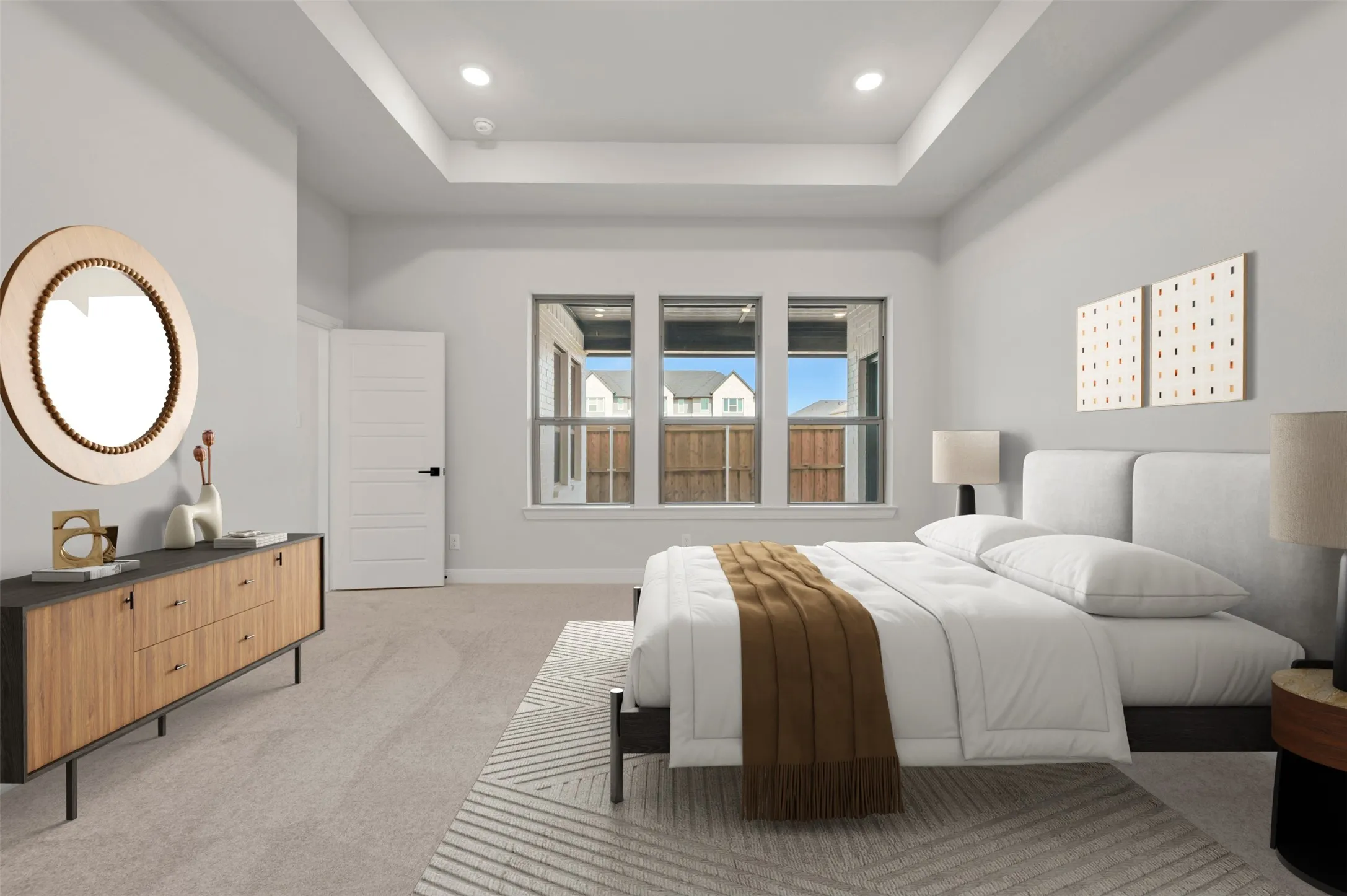 Bedroom featuring light colored carpet, a raised ceiling, and recessed lighting