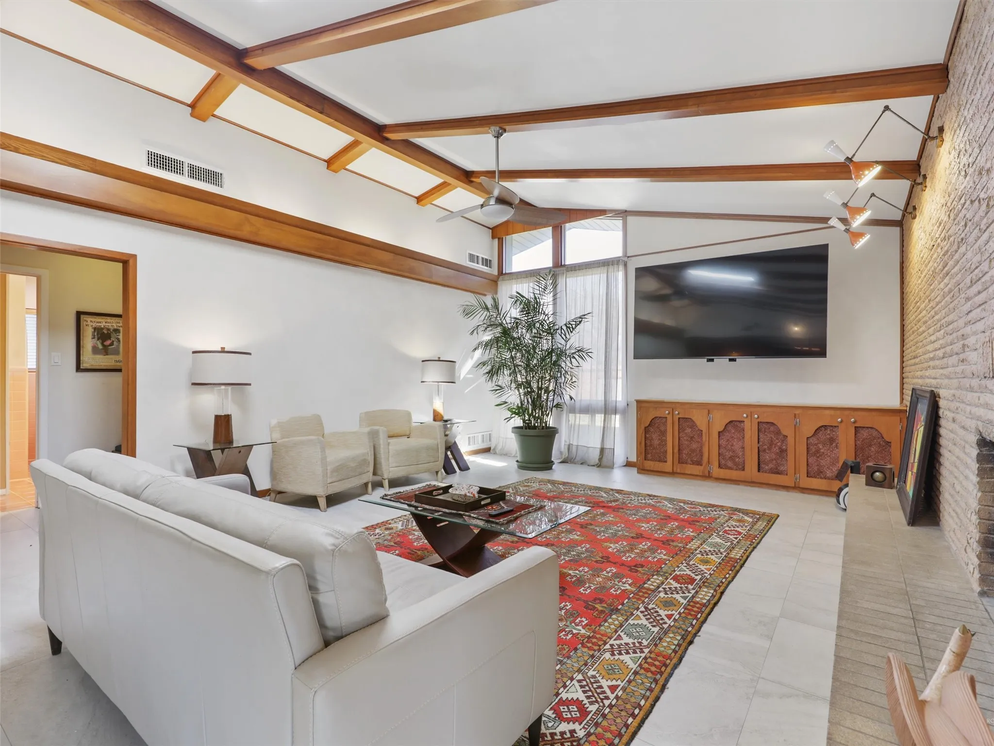 Spacious living room with preserved mid-century architectural details