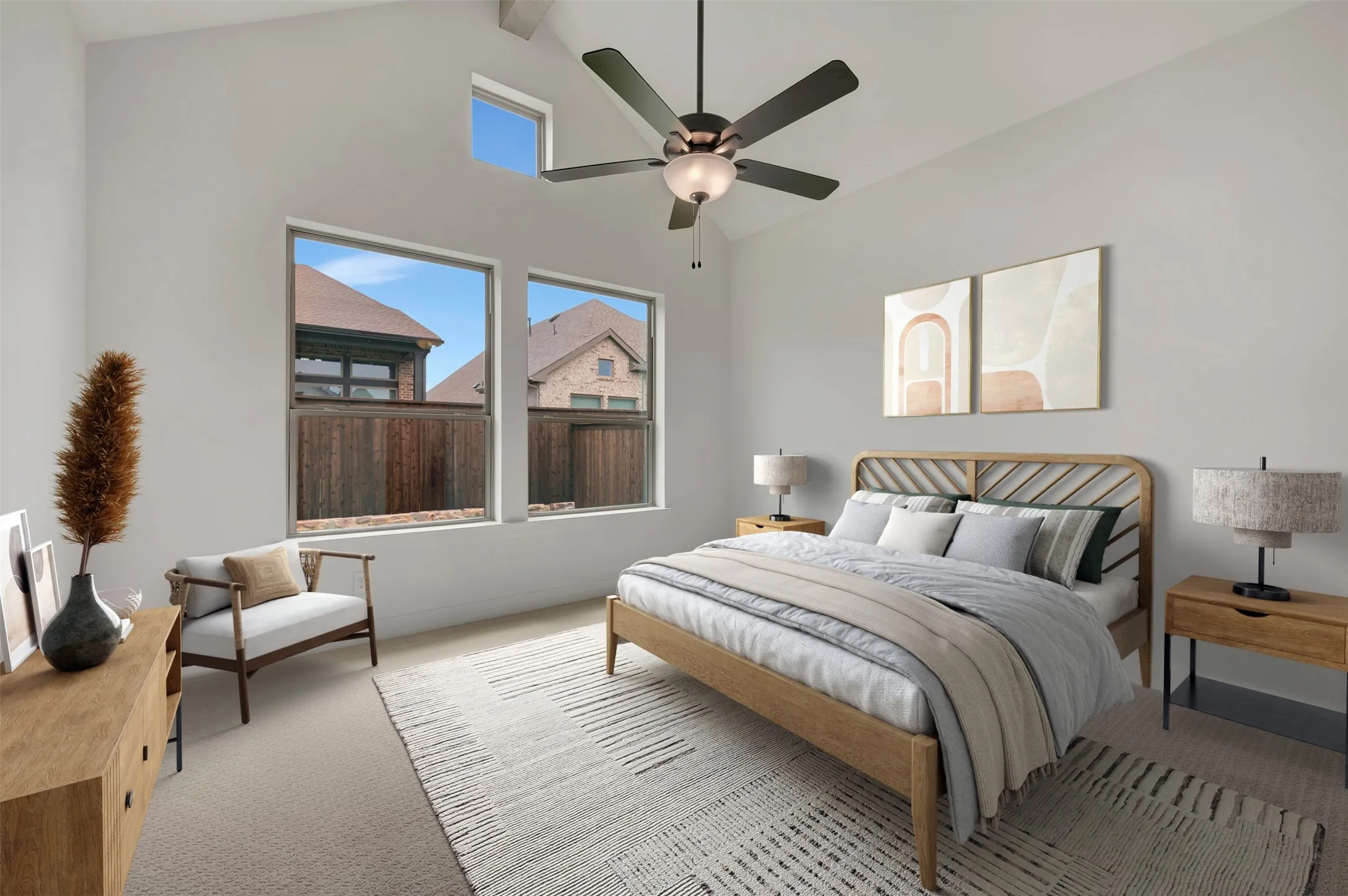 Vaulted ceiling bedroom featuring ample natural light from multiple windows