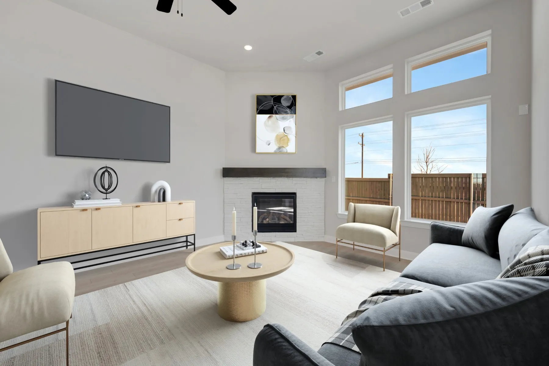 Living area with a glass covered fireplace, light wood finished floors, a ceiling fan, and recessed lighting