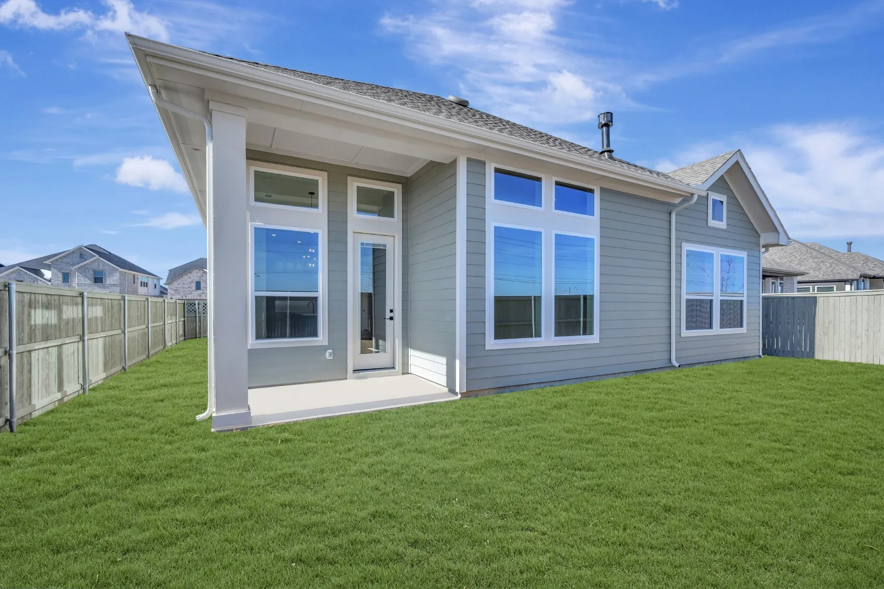 Back of house featuring a patio area and a fenced backyard