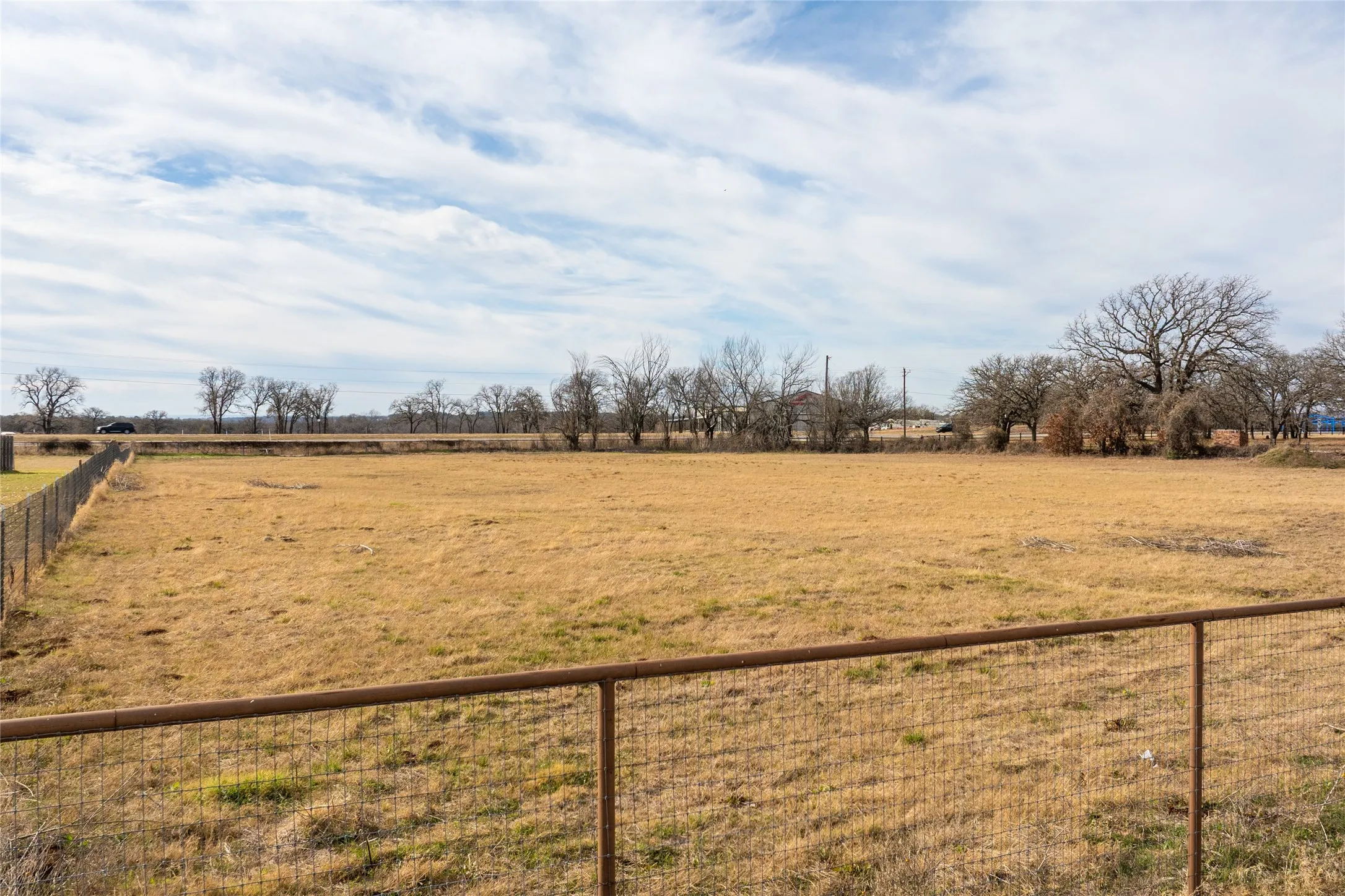 View of yard with a rural view