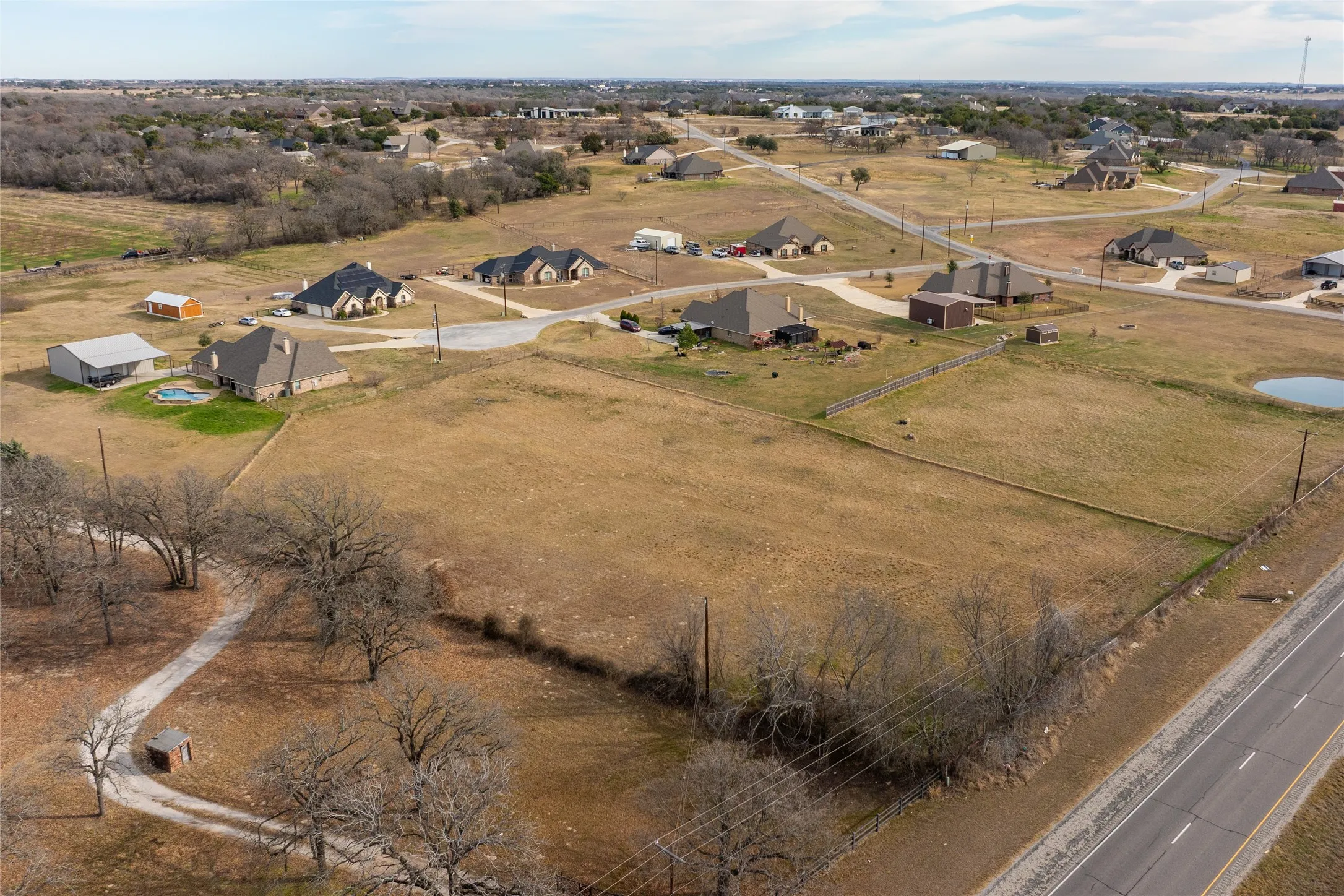 Aerial view of property and surrounding area with rural landscape