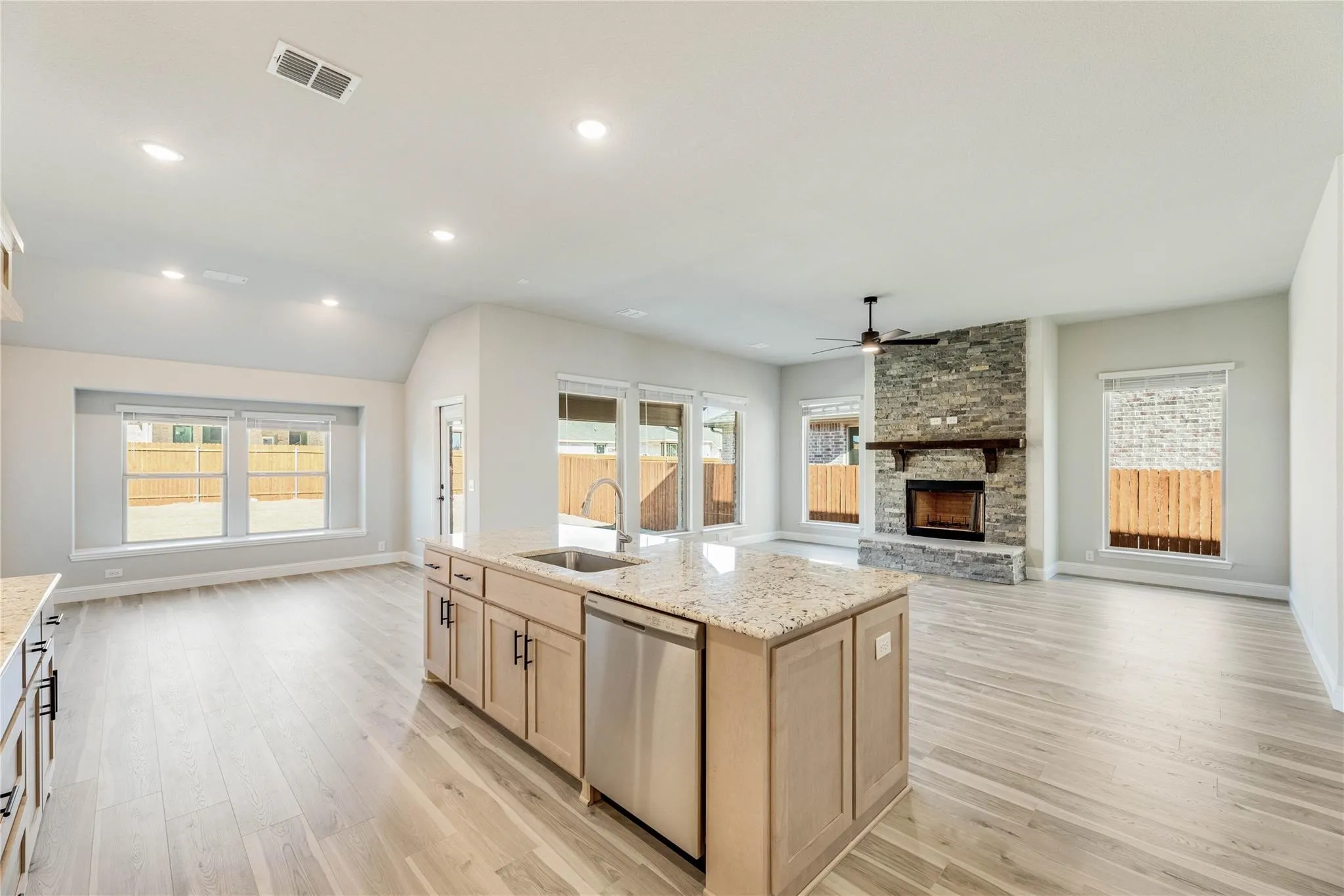 Builder photo when they purchased.  View of the kitchen towards the family room.  Great for entertaining!