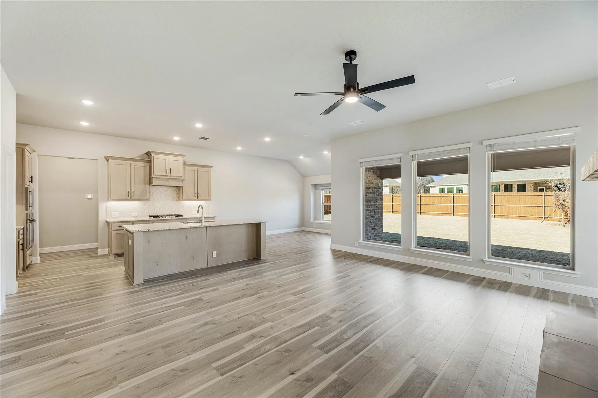 Builder photo when they purchased.  Another view of the family room towards the kitchen.  Picture yourself in this home.  It is gorgeous and such a wonderful floorplan