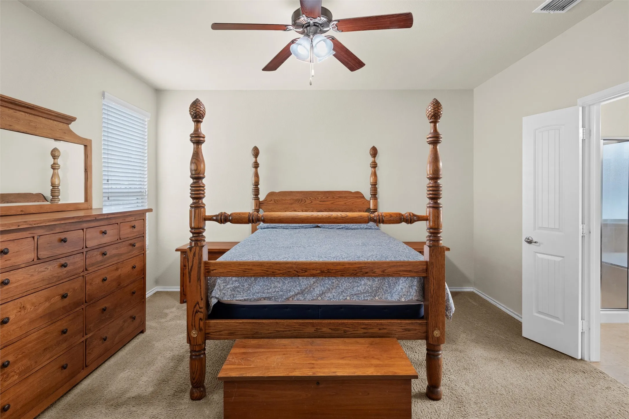 Bedroom with light carpet and ceiling fan