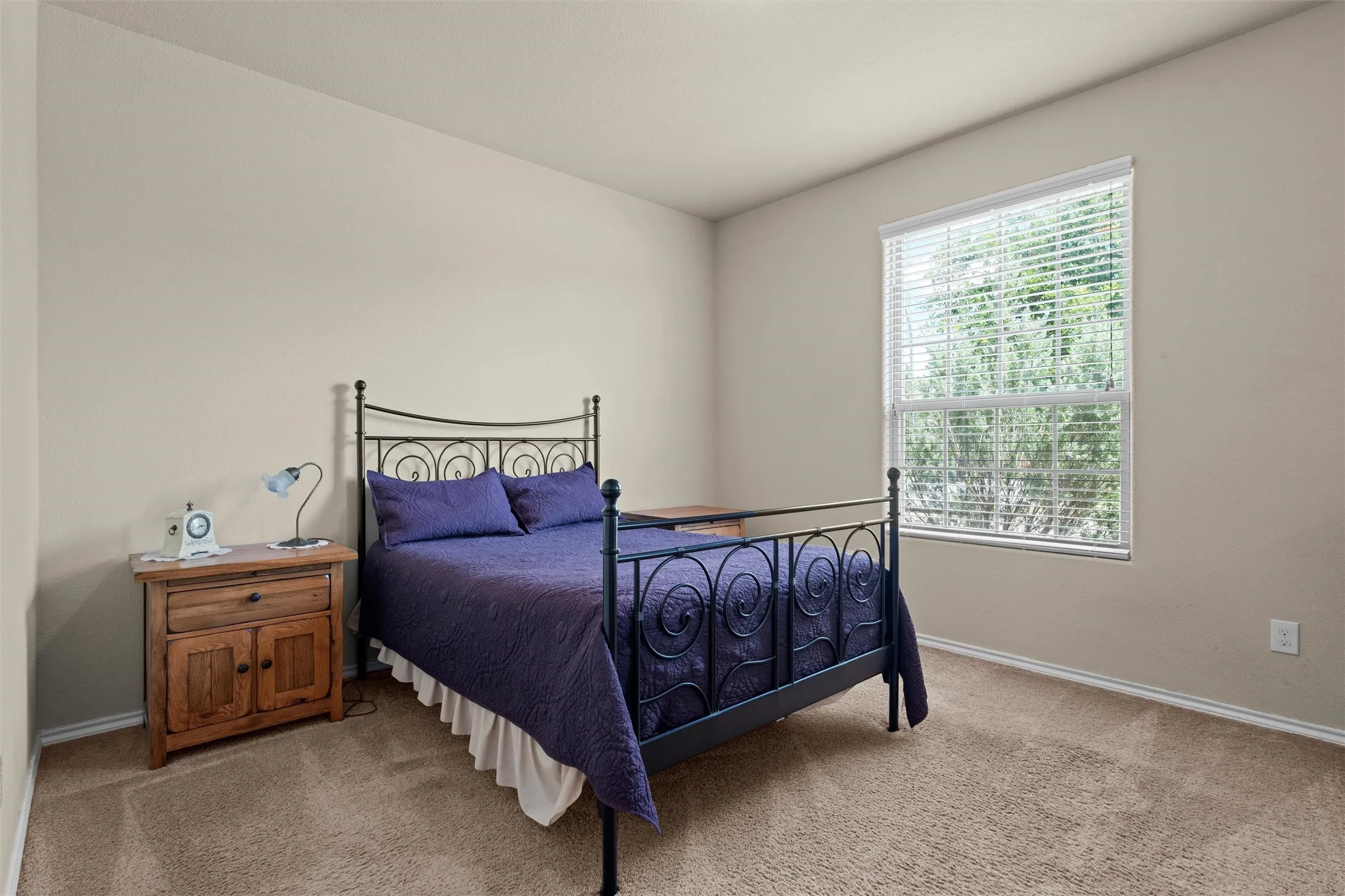 Carpeted bedroom with baseboards