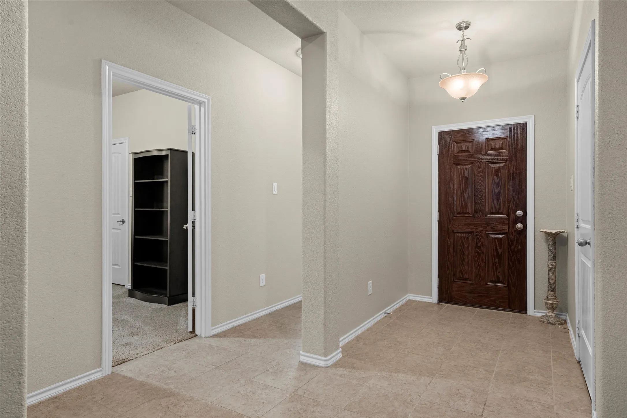Foyer with baseboards