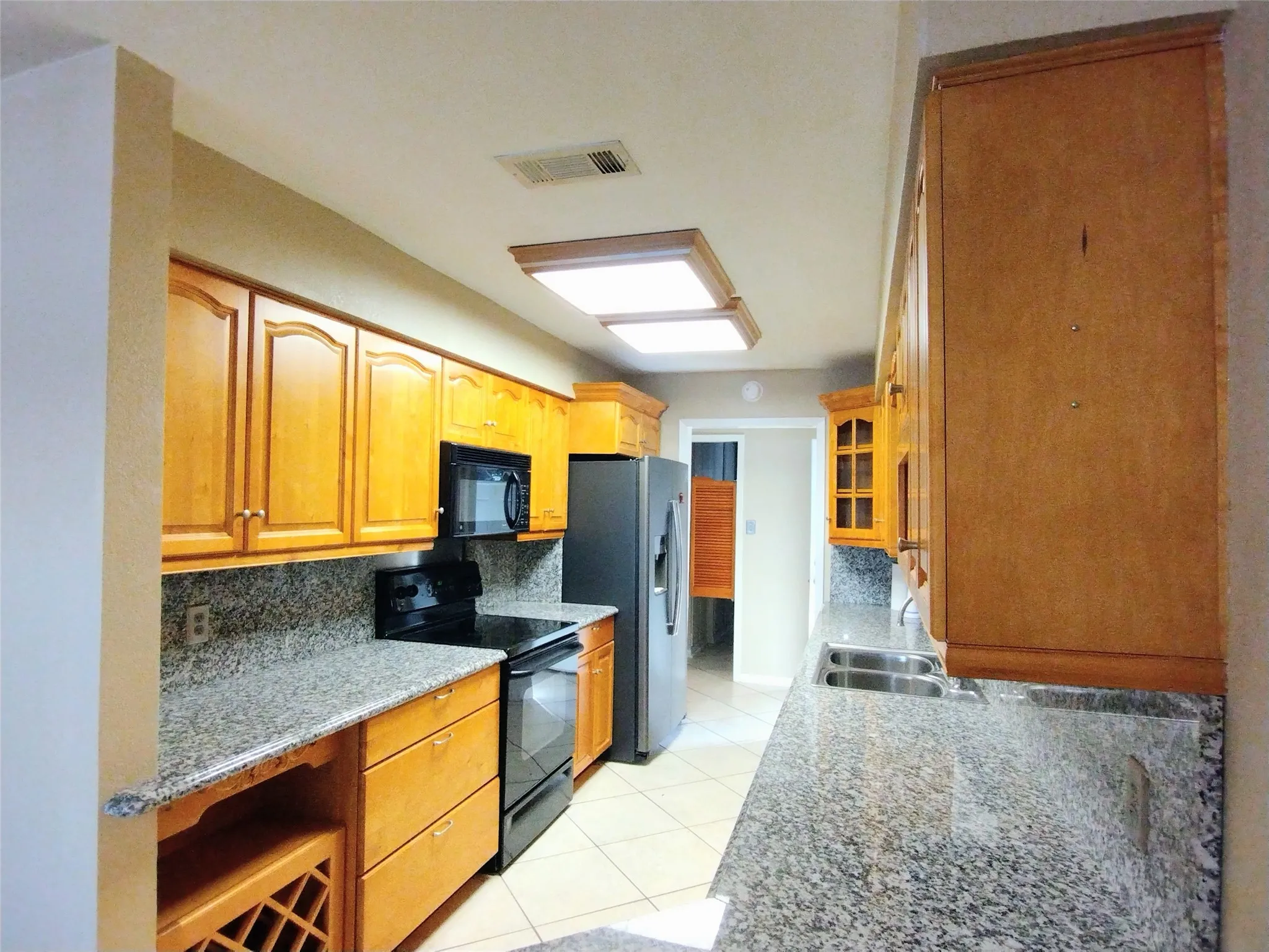 Kitchen with granite countertops and custom cabinets