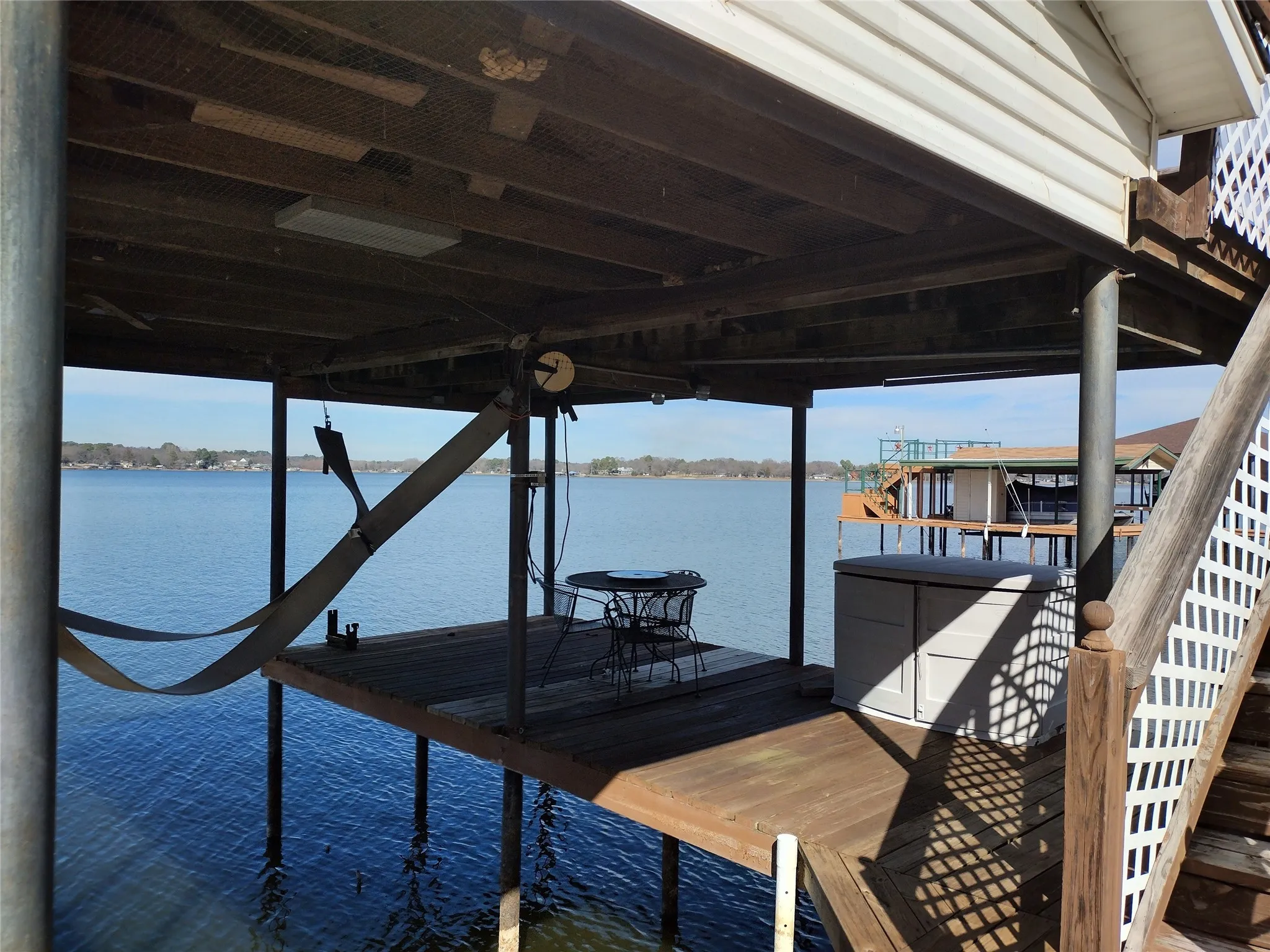 Dock with a water view and boat lift