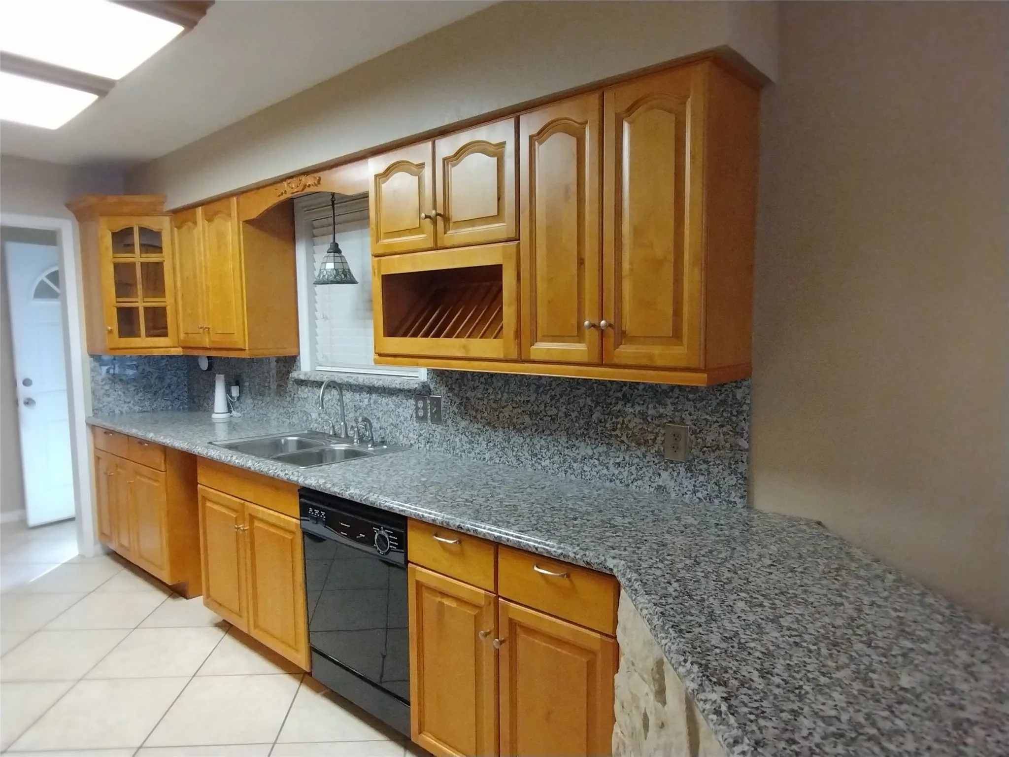 Kitchen with granite countertops and custom cabinets