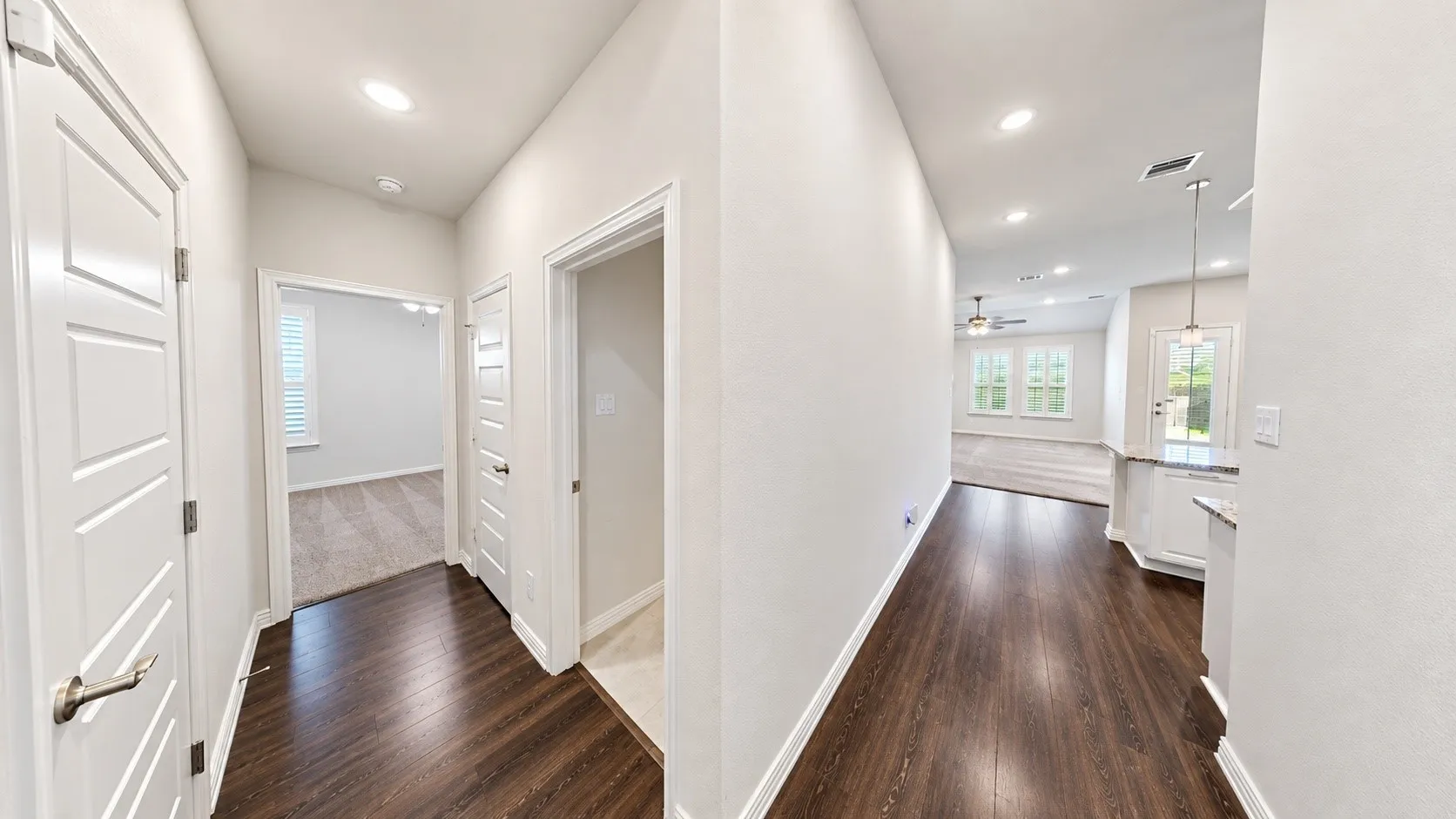 hallway to Garage, Washroom and 3rd bedroom