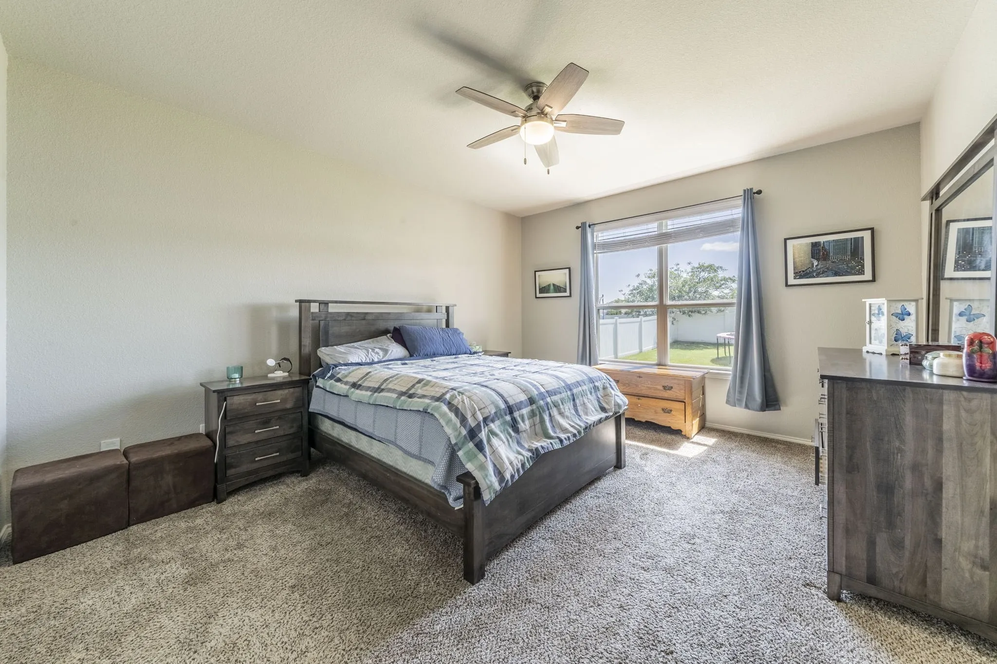 Bedroom featuring carpet floors and ceiling fan