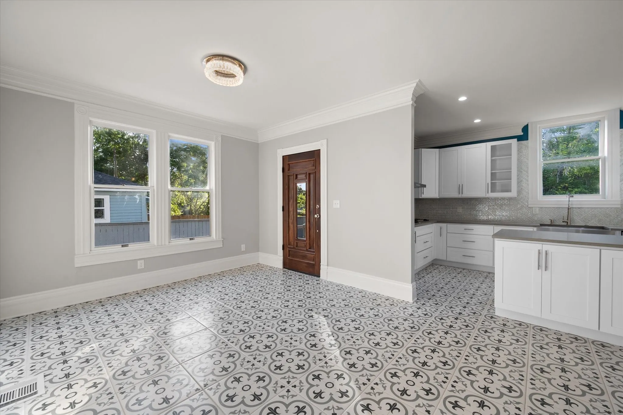 Dining/kitchen door to backyard and detached garage