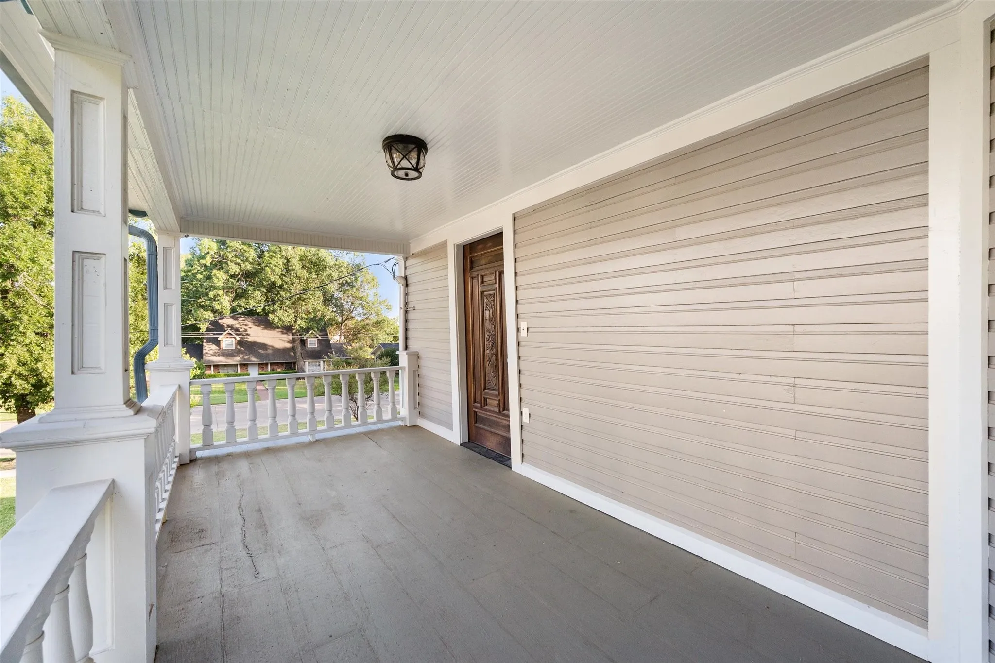 Upstairs covered patio off 2nd story primary bedroom