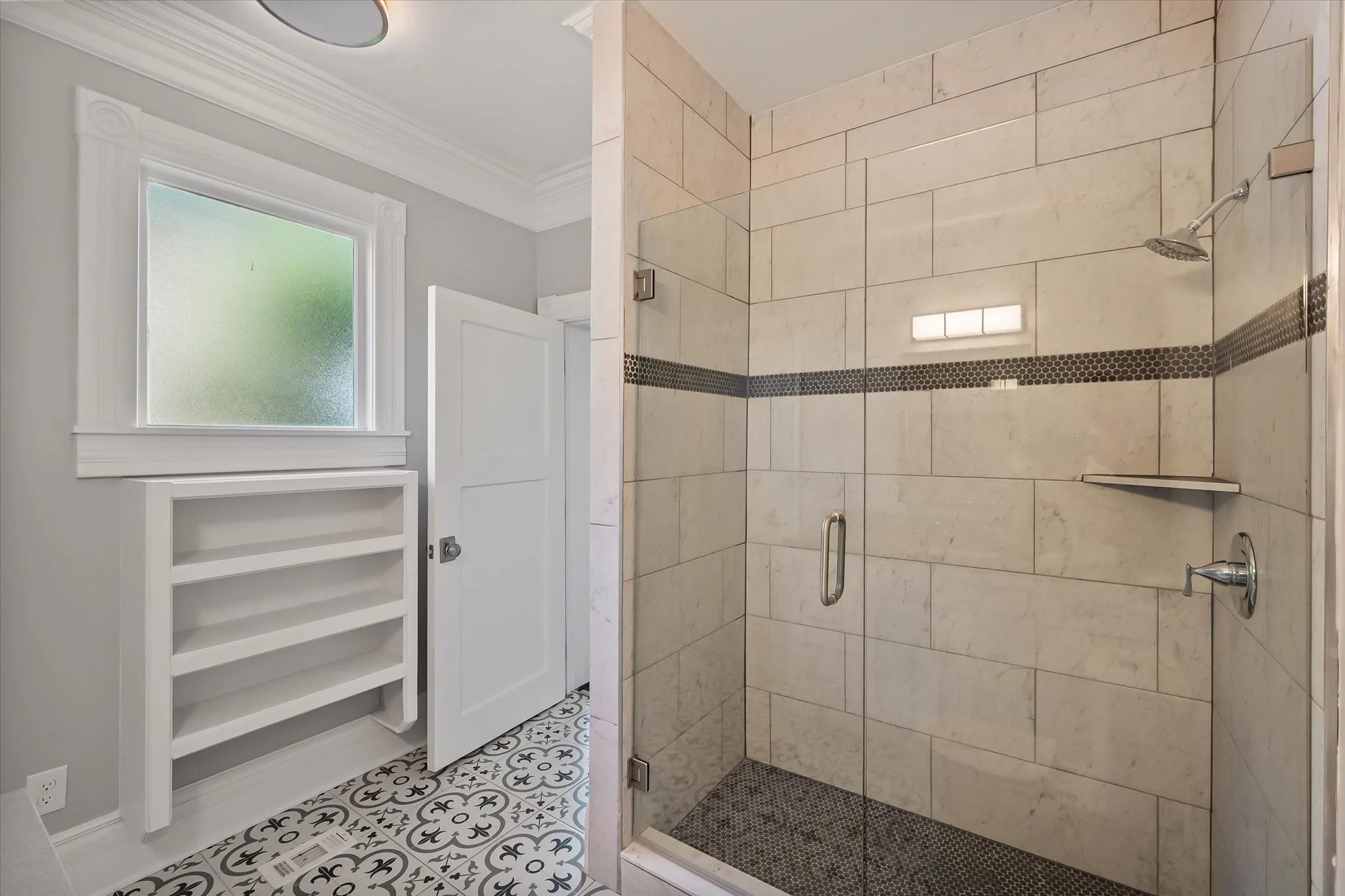 Downsairs walk-in shower attached to 1st floor primary bedroom