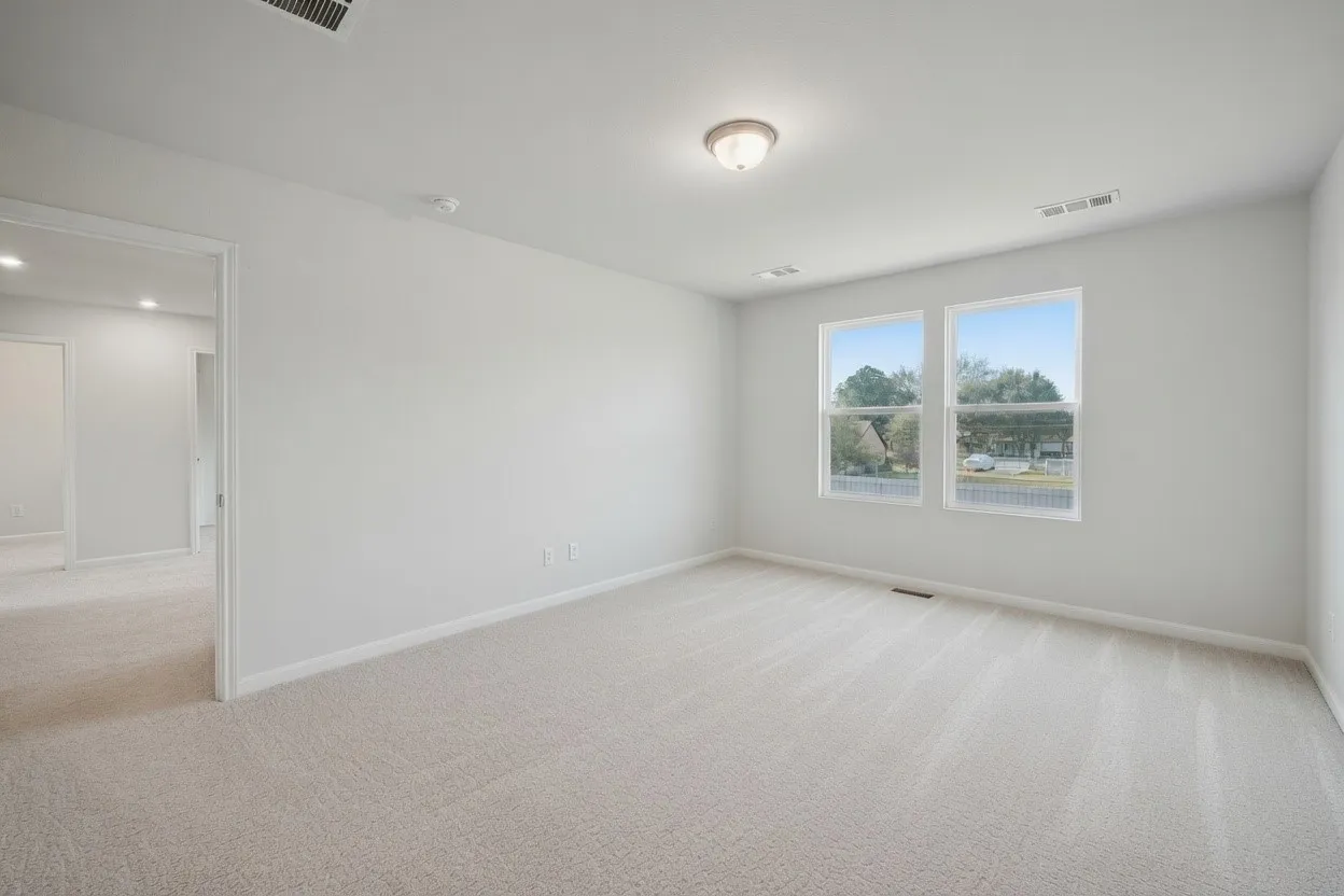 Bedroom with carpet flooring and baseboards
