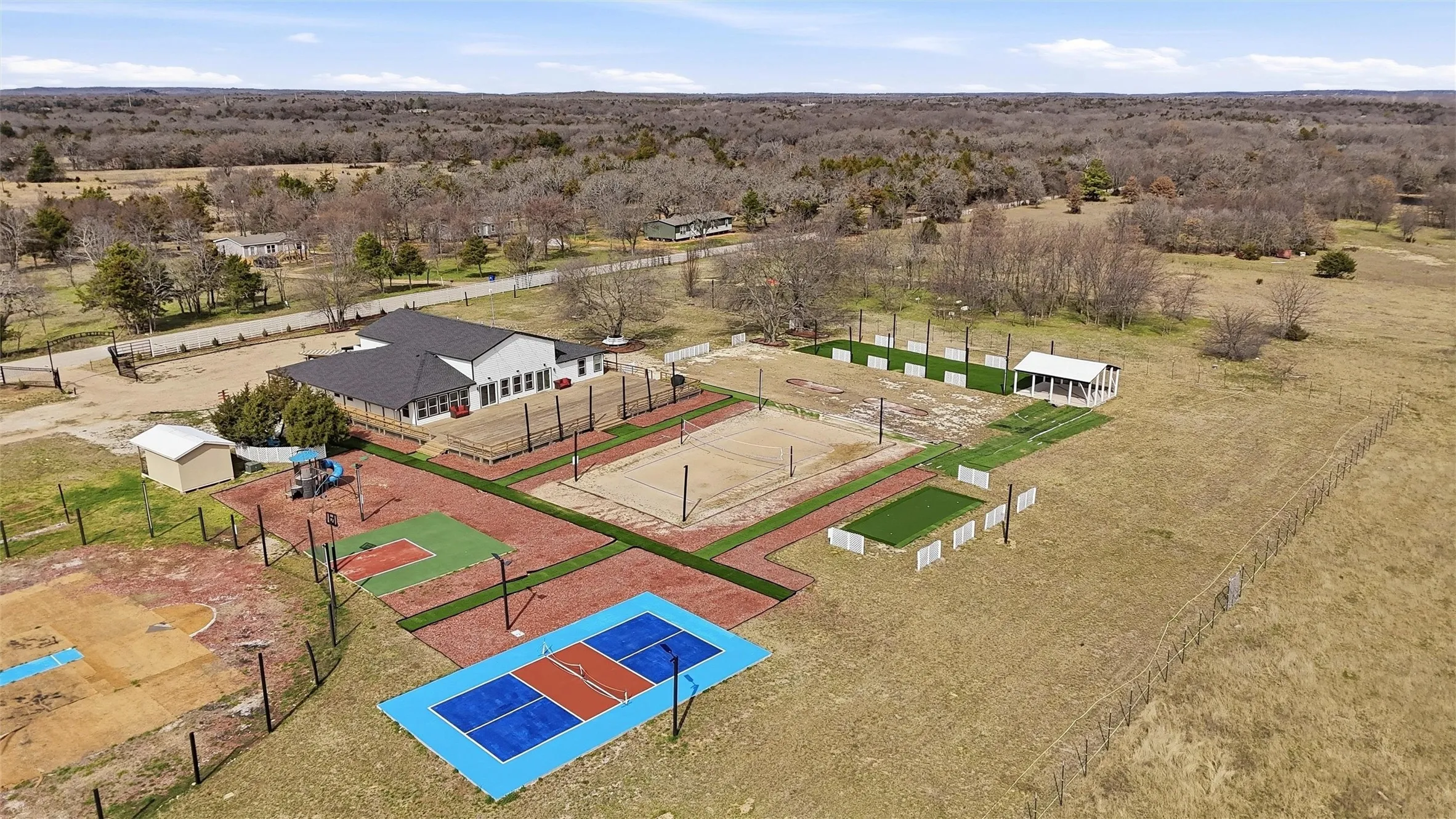 Aerial view of sport courts and back of event center.