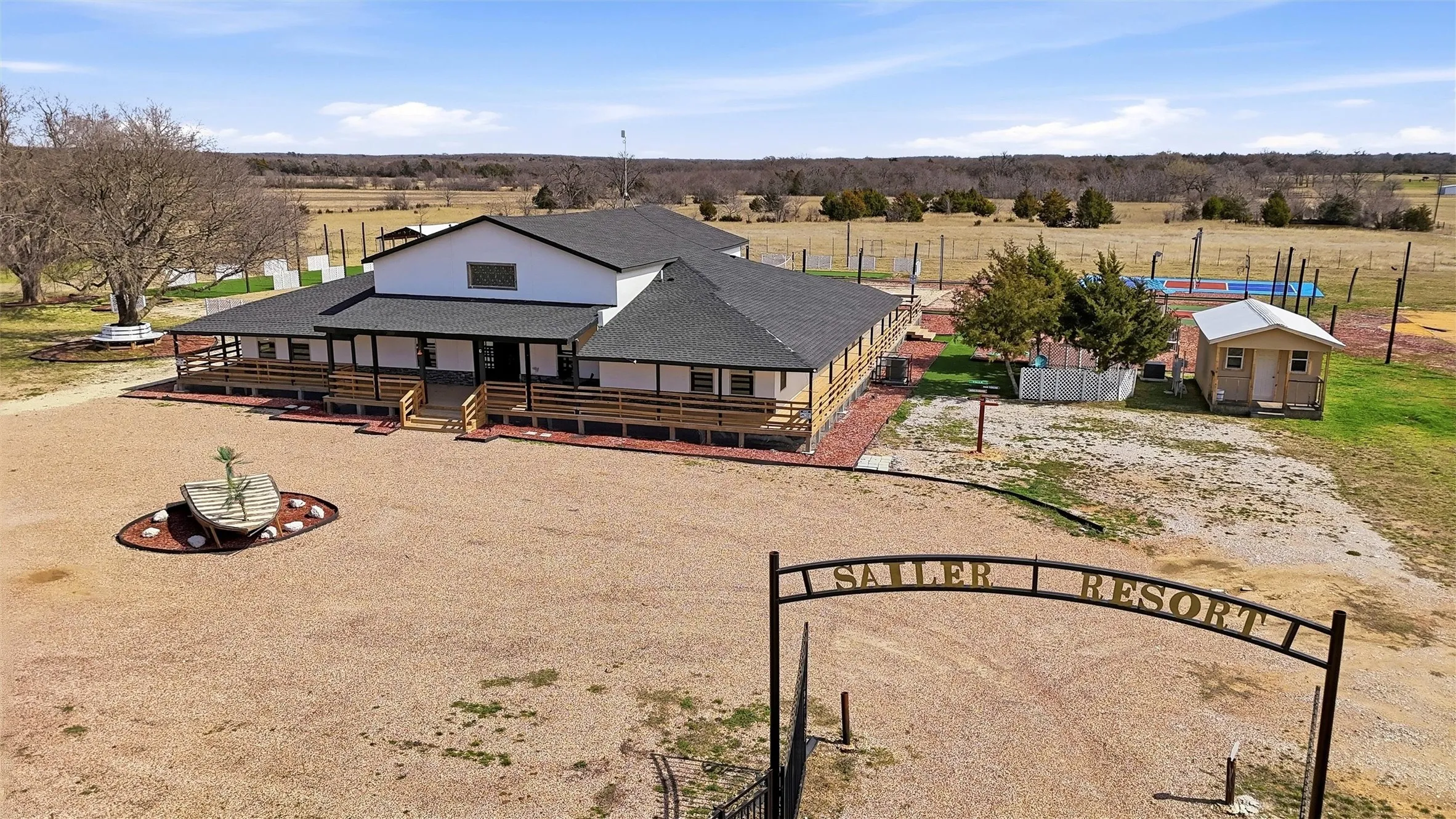 Aerial view of front of property and main entrance.