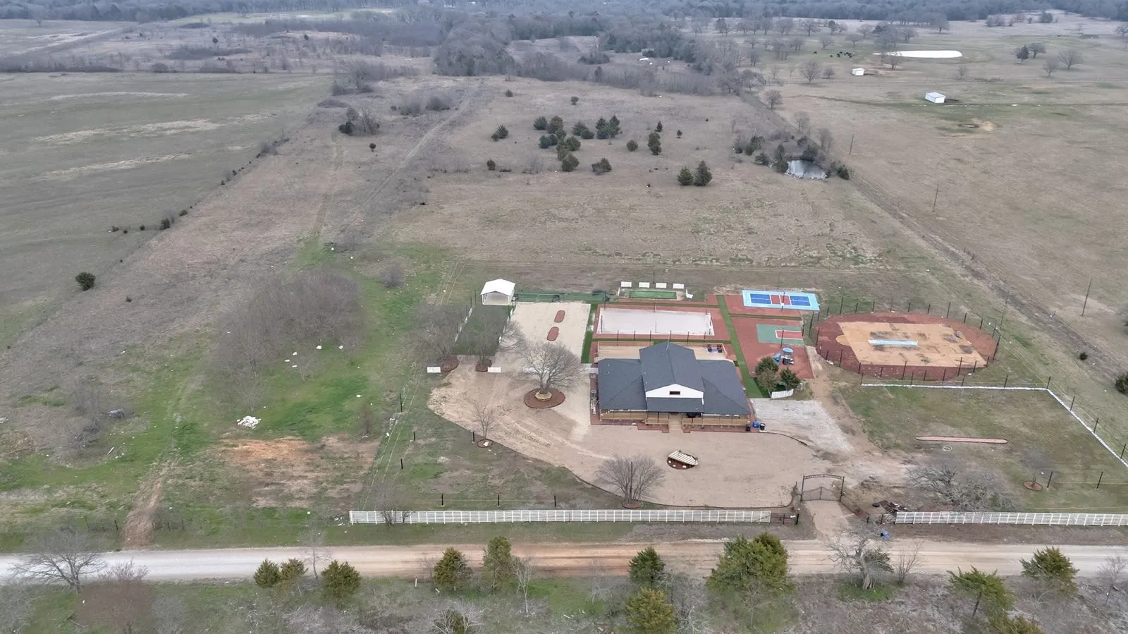Aerial view of event center and adjoining 50+ acres from County Road 297.