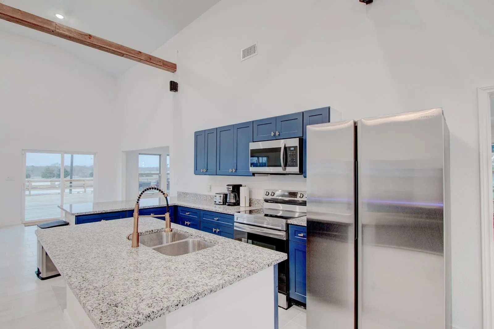 Kitchen with granite counter tops, all stainless appliances.