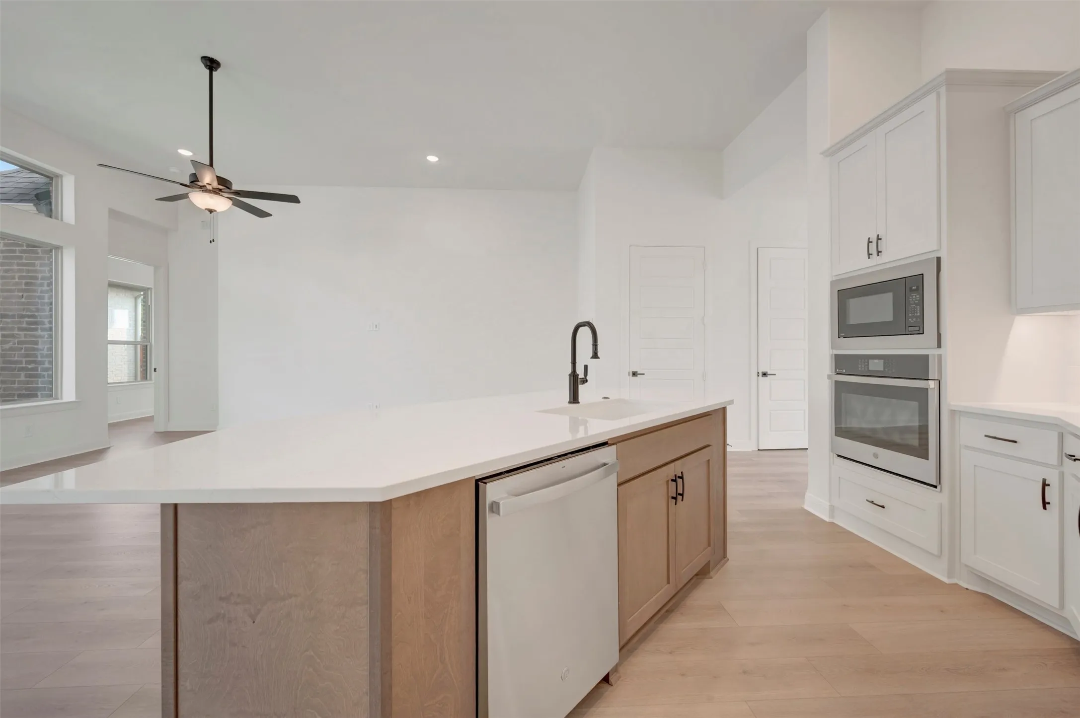 Spacious kitchen island with a white countertop and a built-in sink
