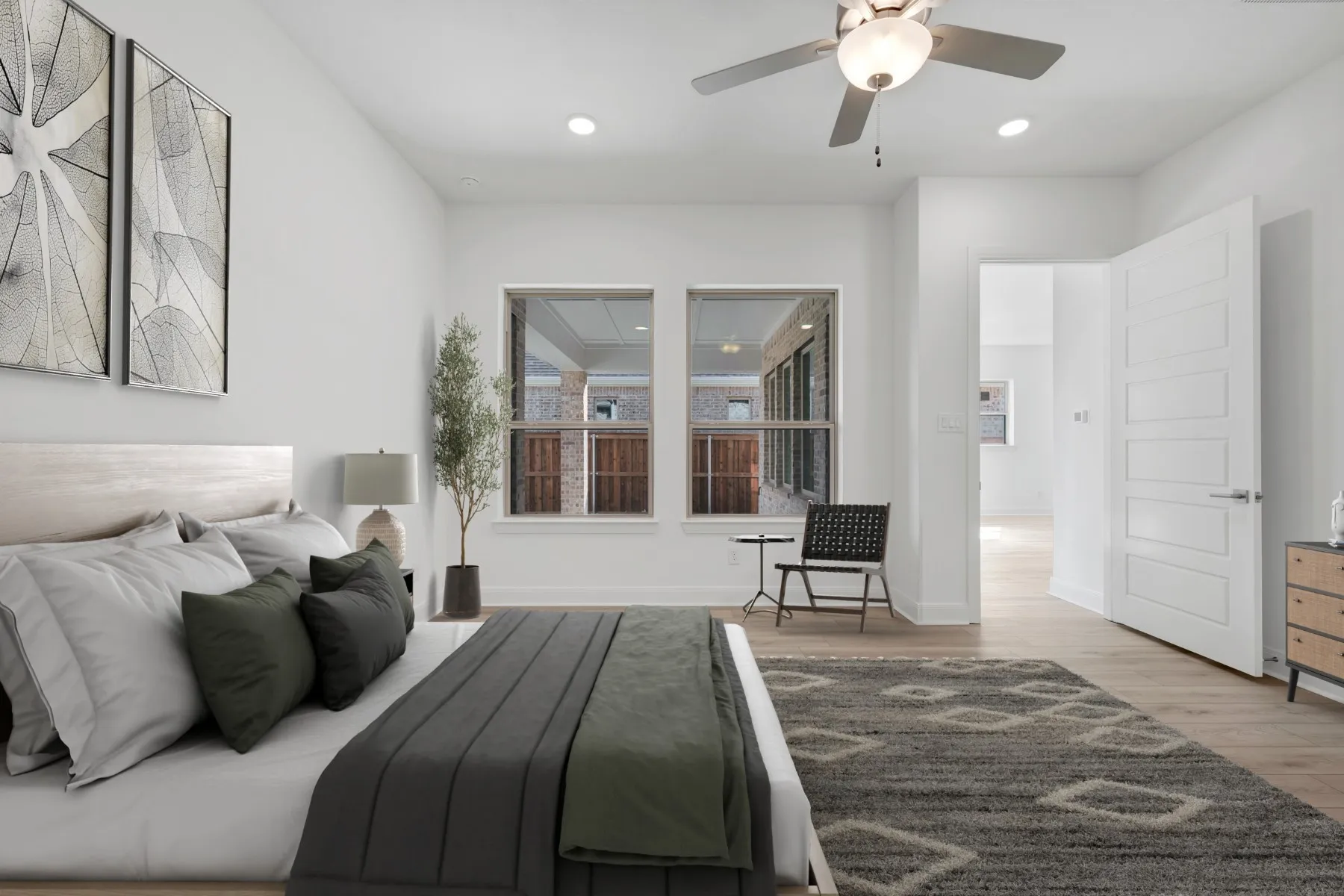 Bedroom with light wood-type flooring, a ceiling fan, and recessed lighting